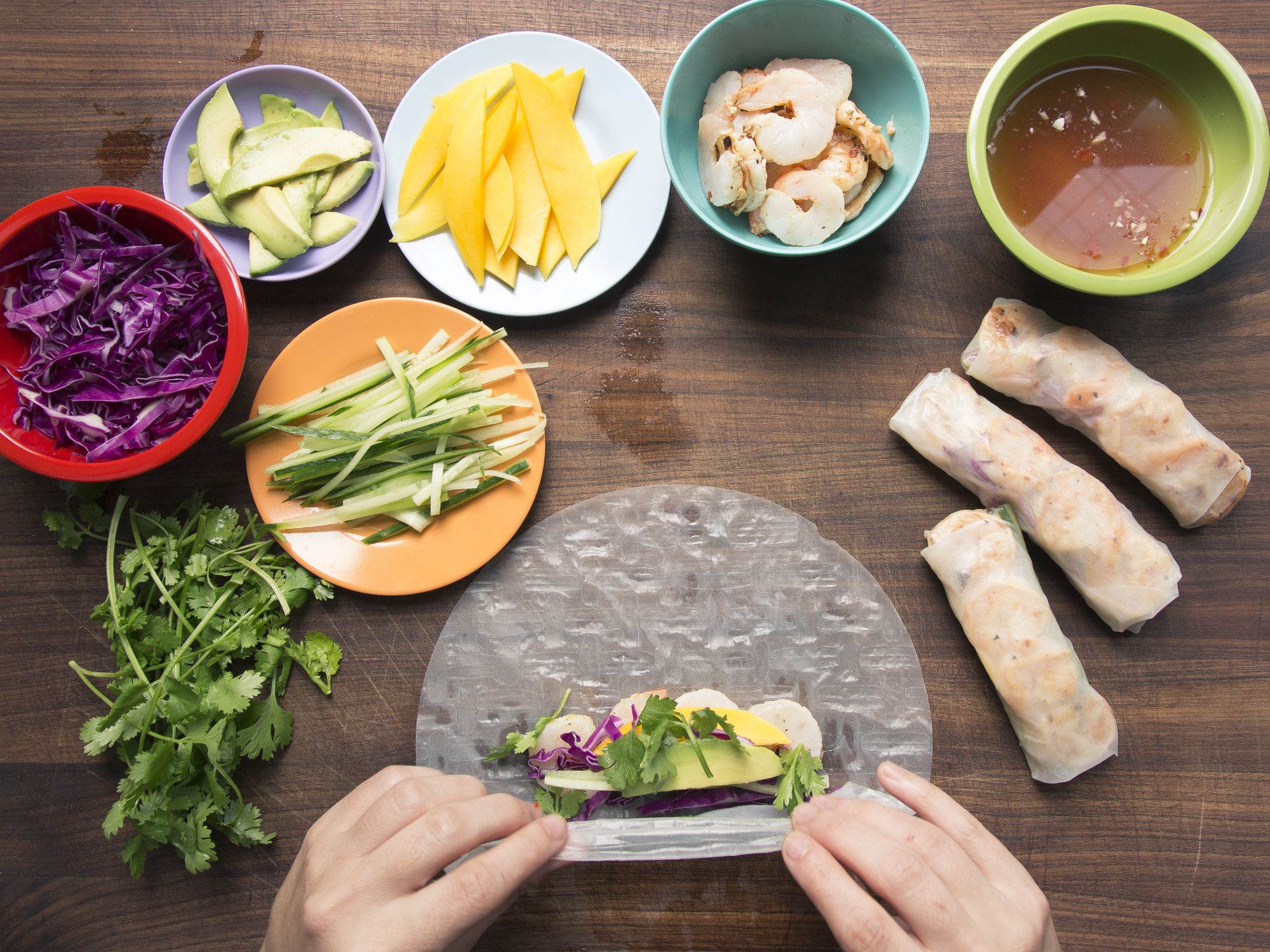 Juicy mango, buttery avocado, and lightly charred sweet shrimp get packed into rice paper along with crispy cabbage and cucumber for a summer appetizer that hits all the right textural notes. Prep the spicy, tart dipping sauce ahead to give the flavors time to meld. Get the recipe for <a href="https://www.saveur.com/grilled-shrimp-summer-rolls-chile-lime-dipping-sauce-recipe/">Grilled Shrimp Summer Rolls</a>