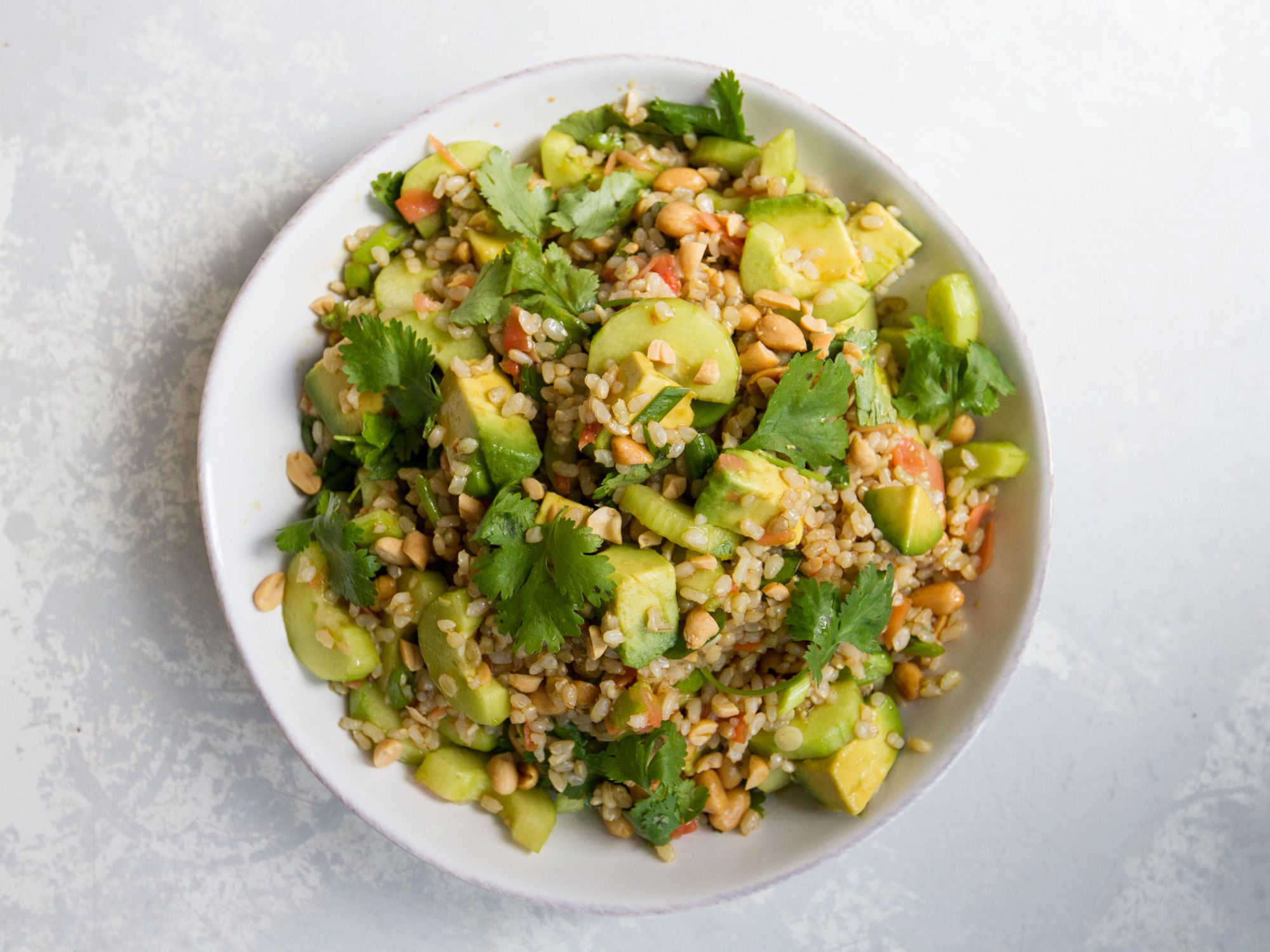 Crunchy peanuts, creamy avocados, and the sweet bite of ginger make this brown rice salad a dish that's full of complex flavors, yet simple to execute. Get the recipe for <a href="https://www.saveur.com/brown-rice-salad-avocado/">Brown Rice Salad with Avocado</a>