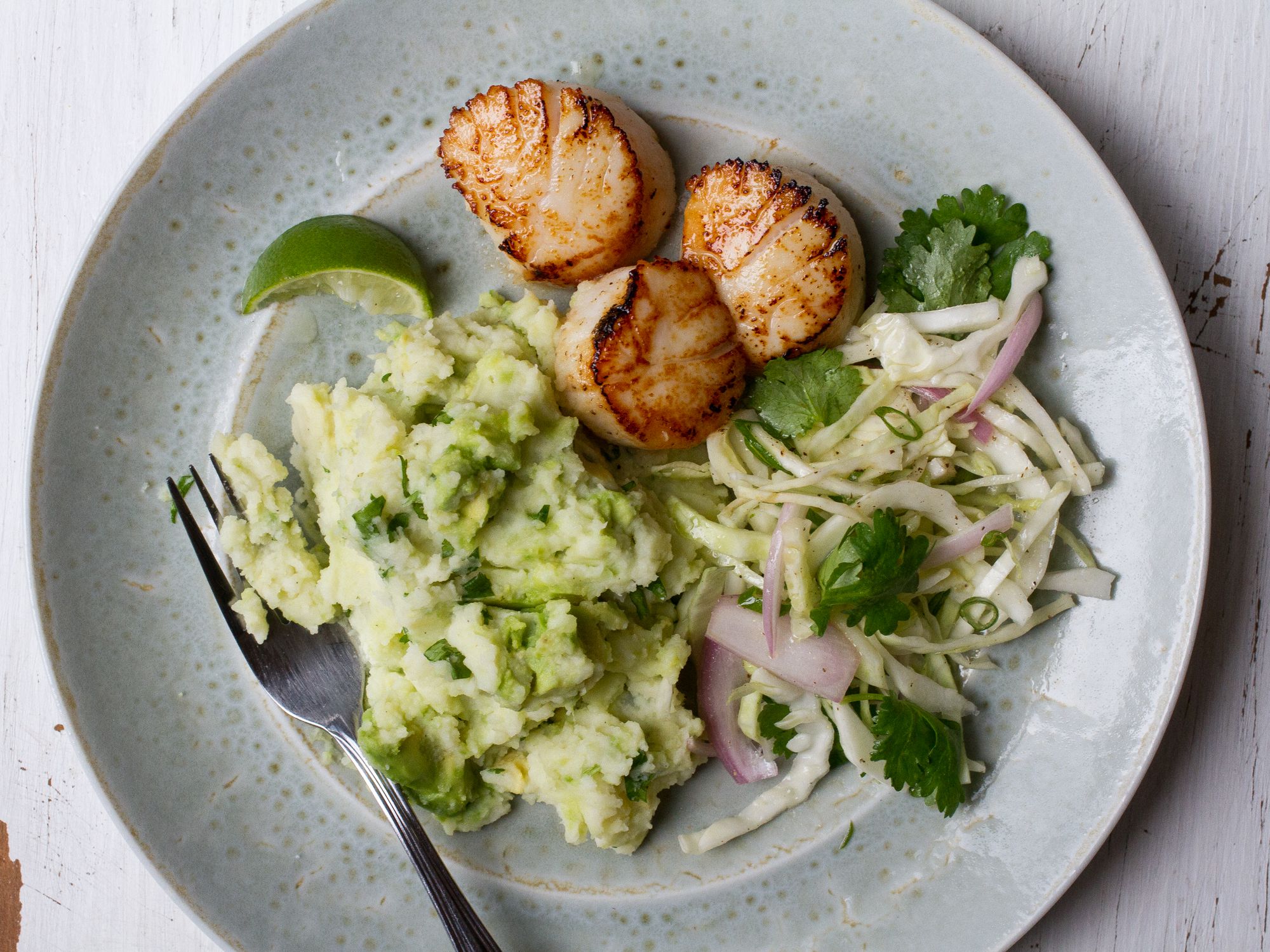 Mashed potatoes go green with avocado and cilantro in this bright recipe. Get the recipe for <a href="http://www.saveur.com/scallops-avocado-mashed-potatoes-recipe">Scallops with Avocado Mashed Potatoes</a>