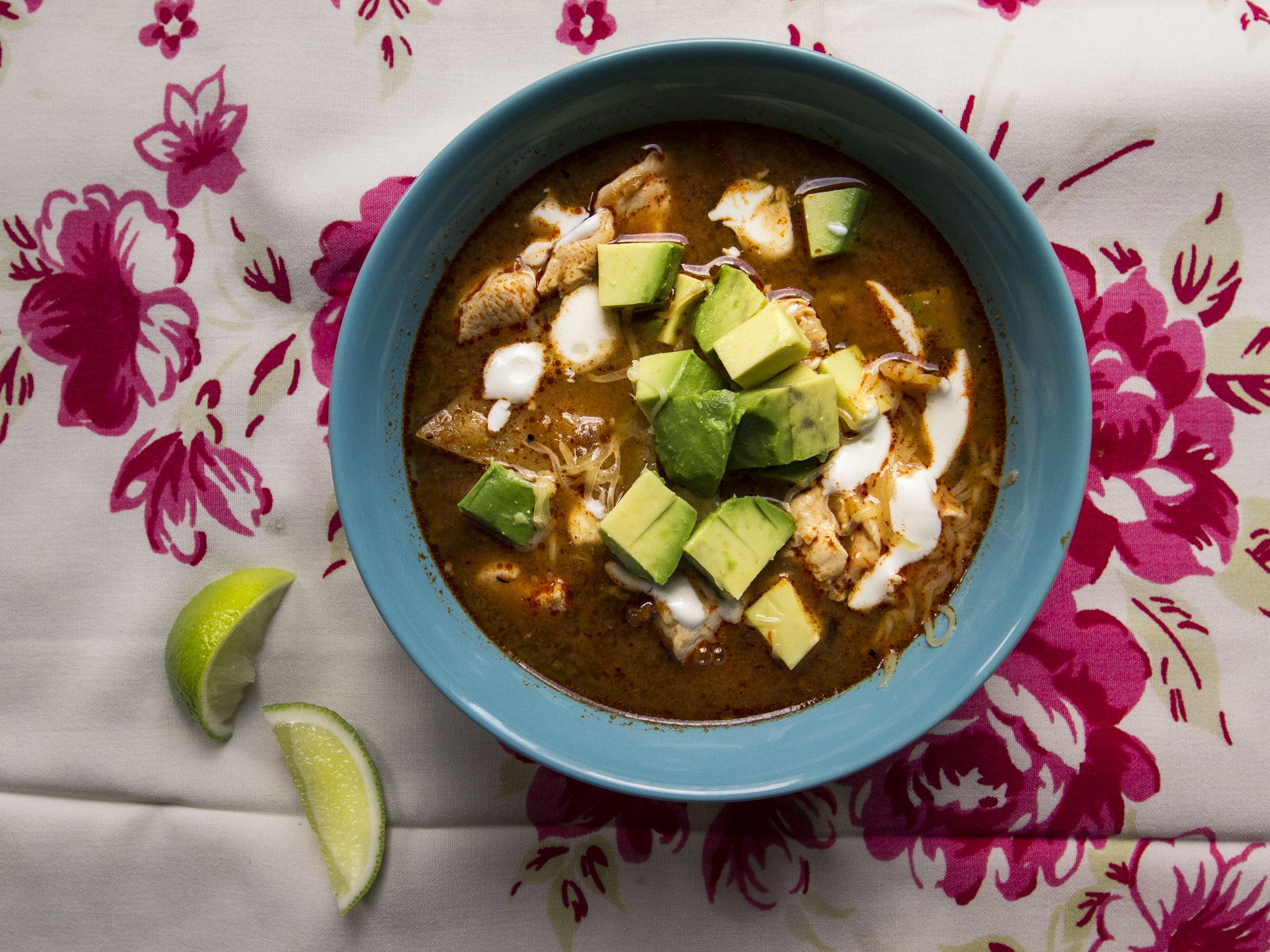 This simple pasilla chile- and tomato-based soup is ladled onto tortilla chips and topped with creamy avocado, jack cheese, and tangy Mexican crema. Get the recipe for <a href="https://www.saveur.com/mexican-tortilla-soup-sopa-azteca-recipe/">Mexican Chicken Tortilla Soup (Sopa Azteca)</a>