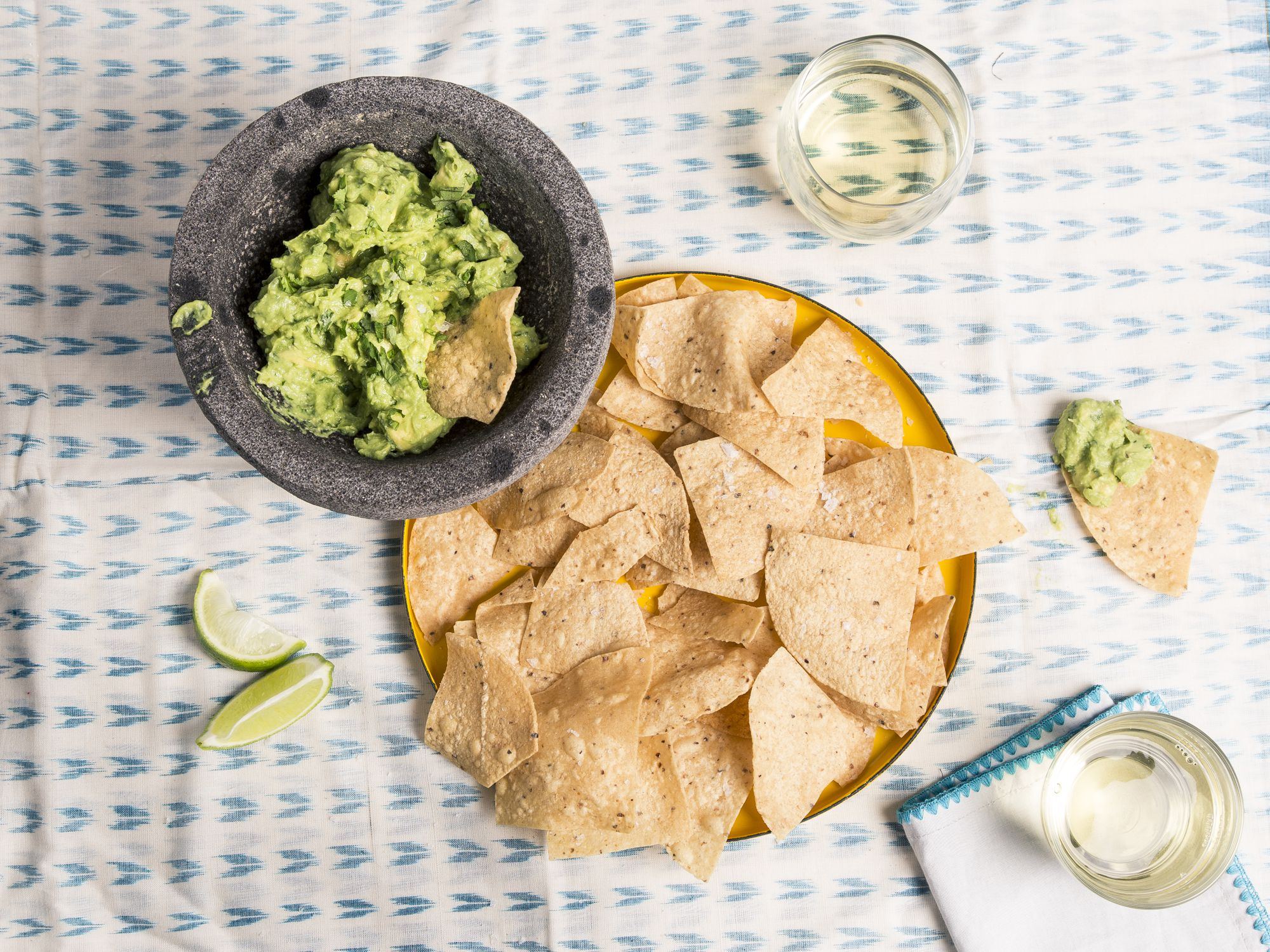 Mexico-born chef Roberto Santibañez makes his chunky, creamy guacamole in the traditional manner: by first grinding the flavoring agents to a paste using a mortar and pestle, then gently mixing in chopped avocados. With light heat from serrano chile and acidity from a hit of lime juice, this classic dip is a surefire crowd-pleaser. Get the recipe for <a href="https://www.saveur.com/classic-guacamole-recipe/">Classic Guacamole</a>