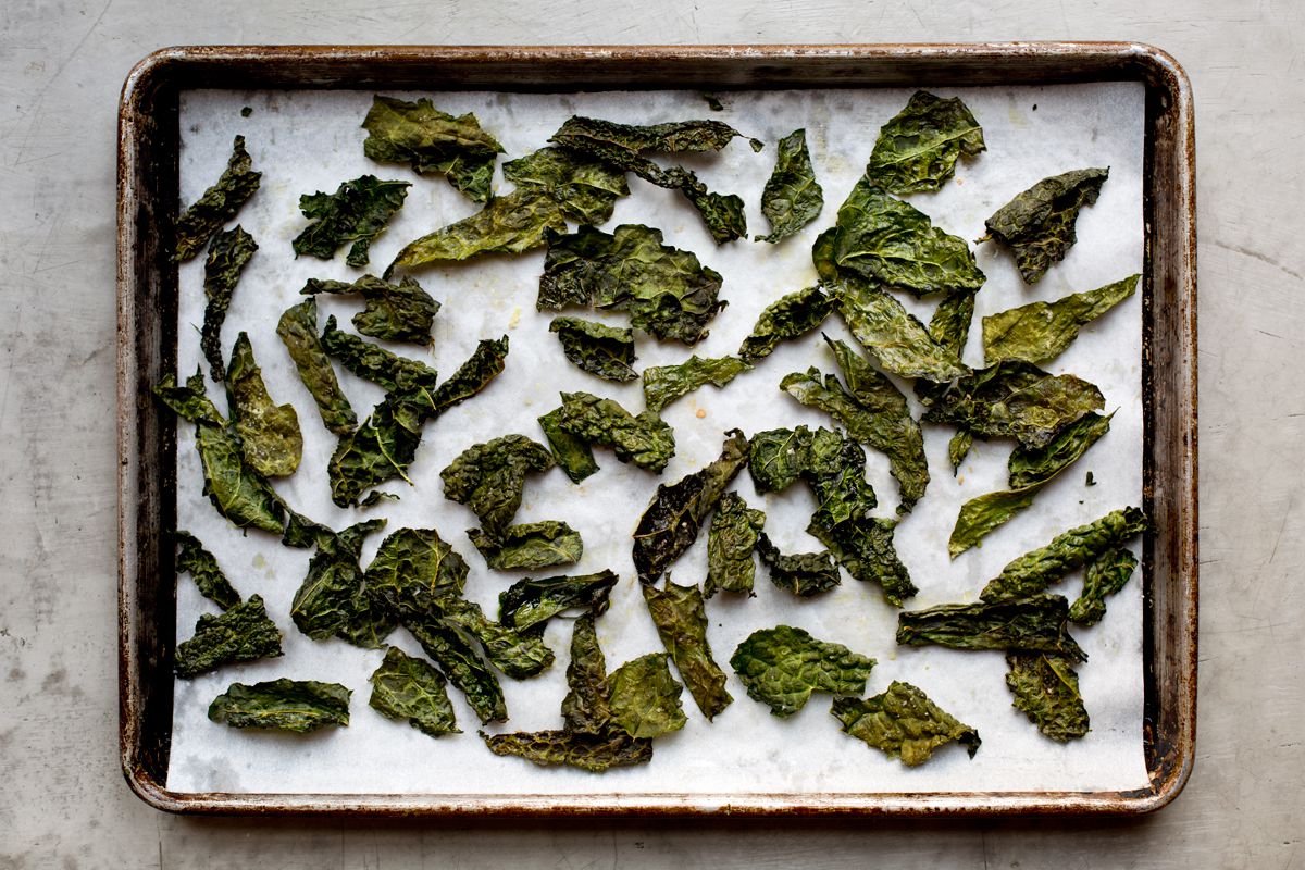 Kale takes on a crispy, addictive texture when drizzled with olive oil and baked. Try these chips tossed into salads, crushed and sprinkled on popcorn, or used to garnish finished dishes—if you can keep from eating them all immediately. Get the recipe for <a href="https://www.saveur.com/article/recipes/make-your-own-kale-chips">Kale Chips</a>