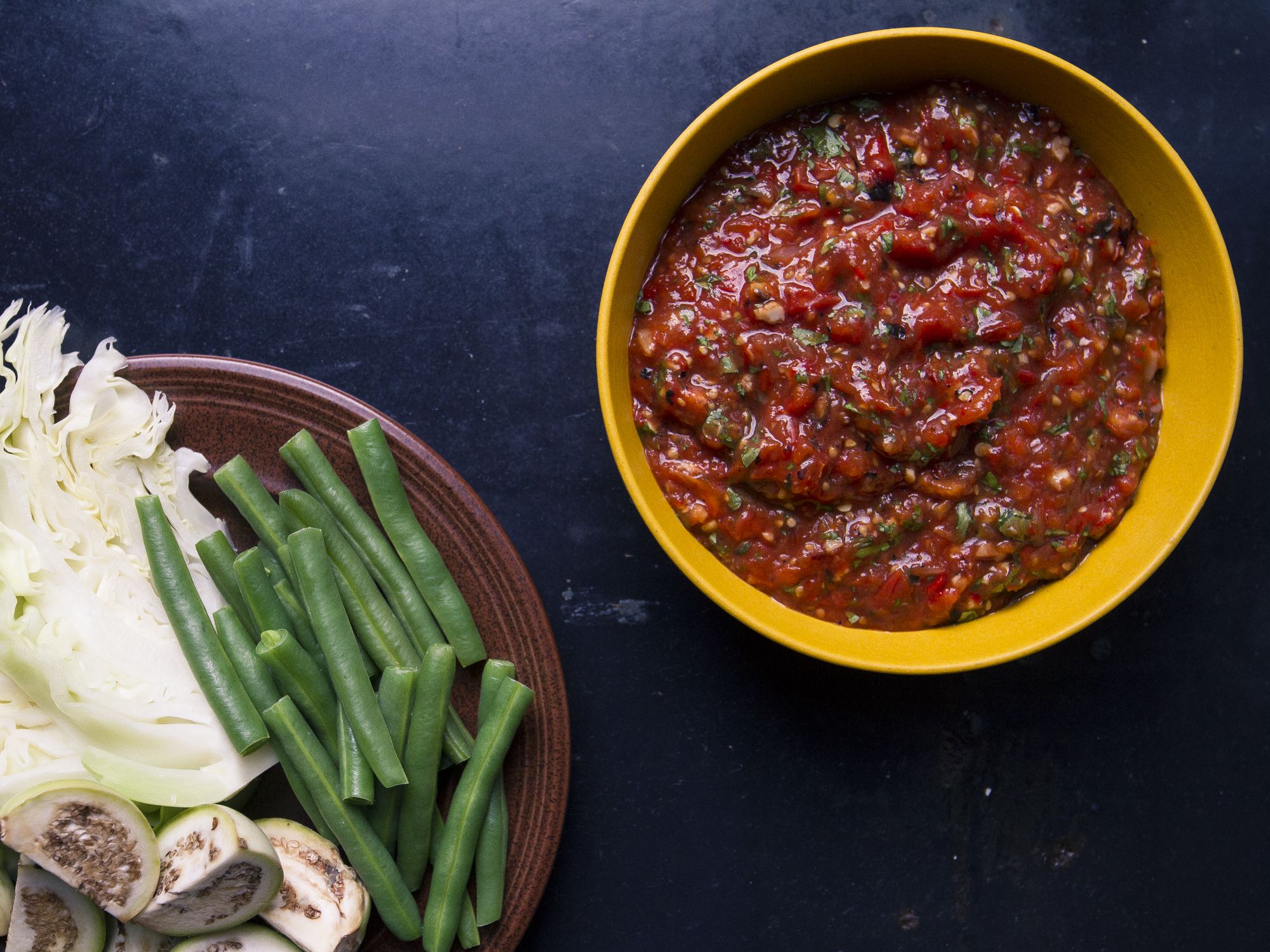 Penn Hongthong, the author of Simple Laotian Cooking (Hippocrene, 2003), taught us that charring the vegetables for this dip is the secret to its smoky flavor. Get the recipe for <a href="https://www.saveur.com/article/Recipes/Lao-Tomato-Dip/">Lao Tomato Dip</a>