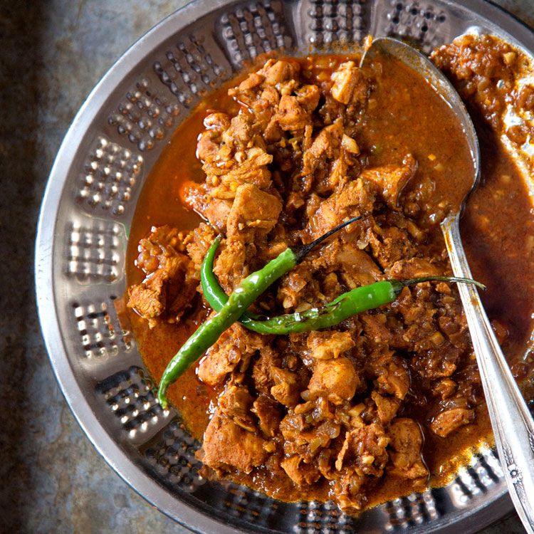 This tangy, spicy curry from Goa, India, has roots in <em>vinh d'alho</em>, a stew brought to the region by Portuguese colonists. Now an Indian restaurant staple, it comes in countless variations—some fiery, some mild—from the subcontinent to the British Isles. Get the recipe for <a href="http://www.saveur.com/classic-chicken-vindaloo">Chicken Vindaloo</a>