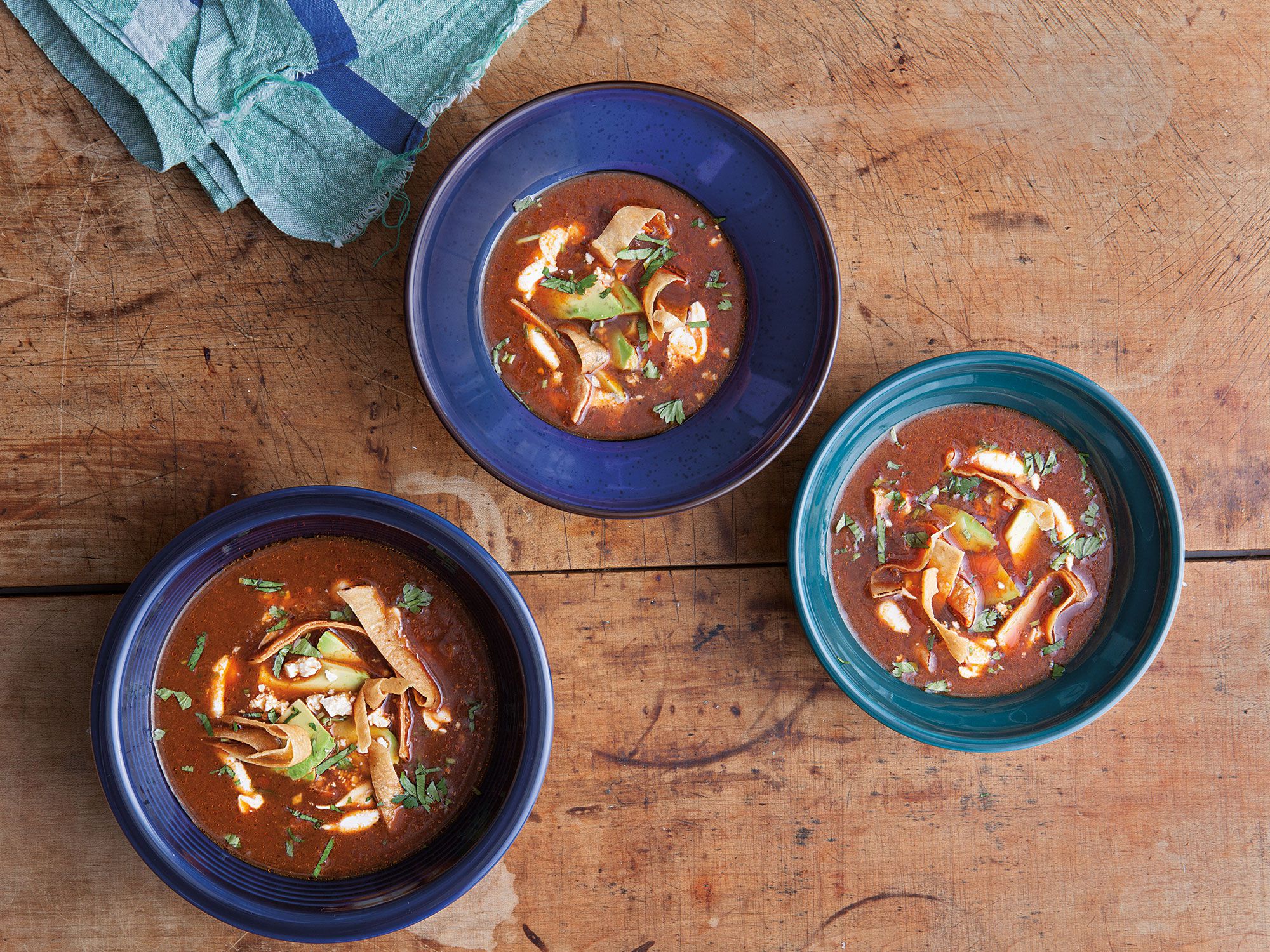 The heat of this deep-red ancho chile soup and its pasilla chile garnish is balanced by the addition of cooling crema and thinly sliced avocado. Get the recipe for <a href="https://www.saveur.com/article/Recipes/Mexico-Ancho-Chile-Soup/">Ancho Chile Soup with Avocado, Crema, and Chile Pasilla (Sopa de Chile Ancho)</a>
