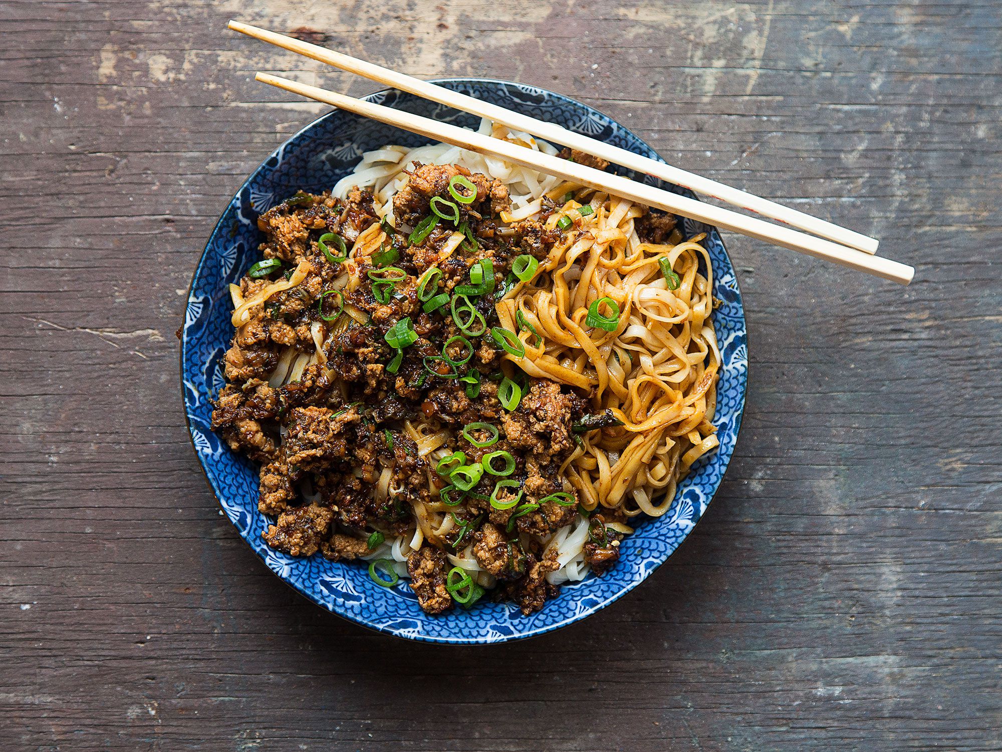 For this beloved dish of China's Sichuan province, a tangle of wheat noodles is topped with a spicy, pungent pork sauce. This recipe is adapted from one in Fuschia Dunlop's <a href="https://amzn.to/2MYB75l" rel="nofollow" title="">Land of Plenty</a> (W.W. Norton & Company, 2003). Get the recipe for <a href="http://www.saveur.com/article/recipes/dan-dan-mian-sichuan-noodles-with-spicy-pork-sauce">Sichuan Noodles with Spicy Pork Sauce (Dan Dan Mian)</a>