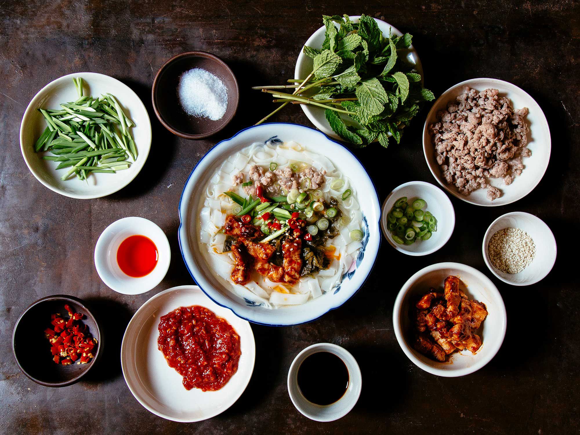 This popular breakfast in China's Yunnan Province starts with fresh rice noodles and ground meat in a bare-bones pork broth, then gets customized with as many as a dozen condiments. Yunnan mi xian noodles (round and spaghettilike) or mi gan (flat and wide) are traditional, but any size rice noodle works, and dried varieties are fine in a pinch. Find fresh rice noodles in the refrigerated section at most Asian markets. Get the recipe for <a href="http://www.saveur.com/yunnan-style-breakfast-noodle-soup-recipe">Yunnan-Style Breakfast Noodle Soup (Mi Xian)</a>