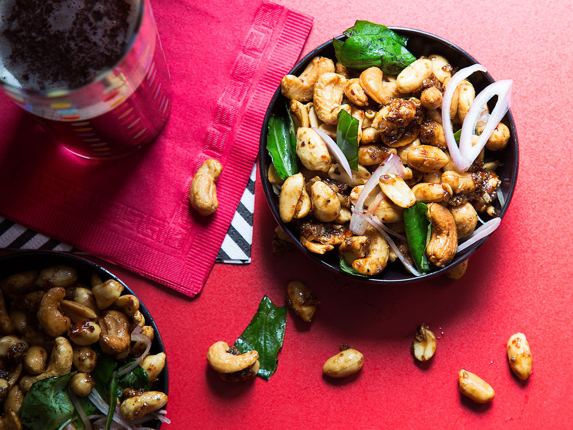 Toss cashews and peanuts in caramelized sugar, fish sauce, garlic, and chile for a powerful, can't-stop-eating bar snack. Add the lime, shallot, and basil right before serving so the nuts stay crispy. Get the recipe for <a href="http://www.saveur.com/spicy-cashew-peanut-recipe">Spicy Cashew-Peanut Bar Mix</a>