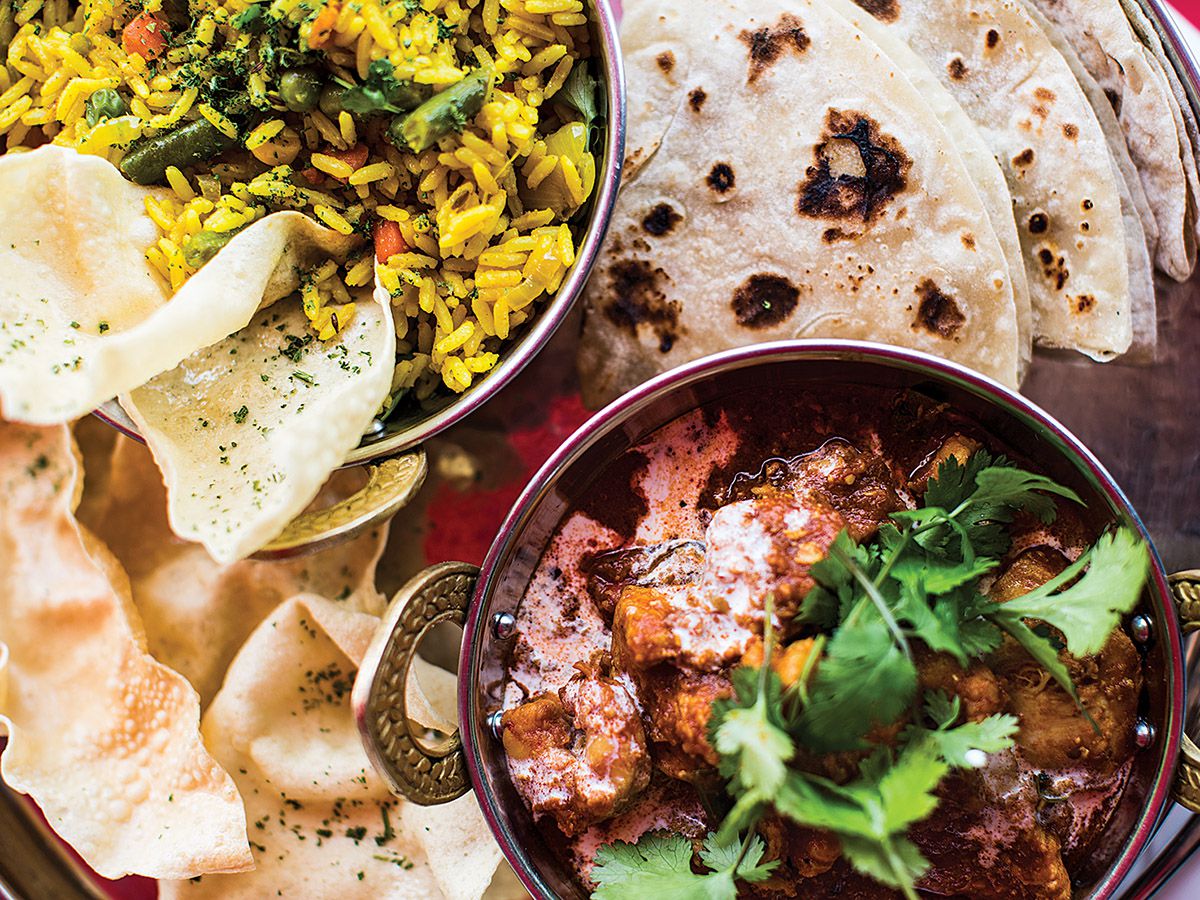 Characteristic of the region's curries, this intensely spicy one from chef Kevin Joseph of Durban's The Oyster Box hotel gets its heat not from chiles, but pastes made of fresh garlic, ginger, and onions, plus lots of curry powder. Though not cooked long, the sauce is rich and thick thanks to heaps of ground spices and unsweetened coconut cream. Get the recipe for <a href="http://www.saveur.com/chicken-and-prawn-curry">Chicken and Shrimp Curry</a>