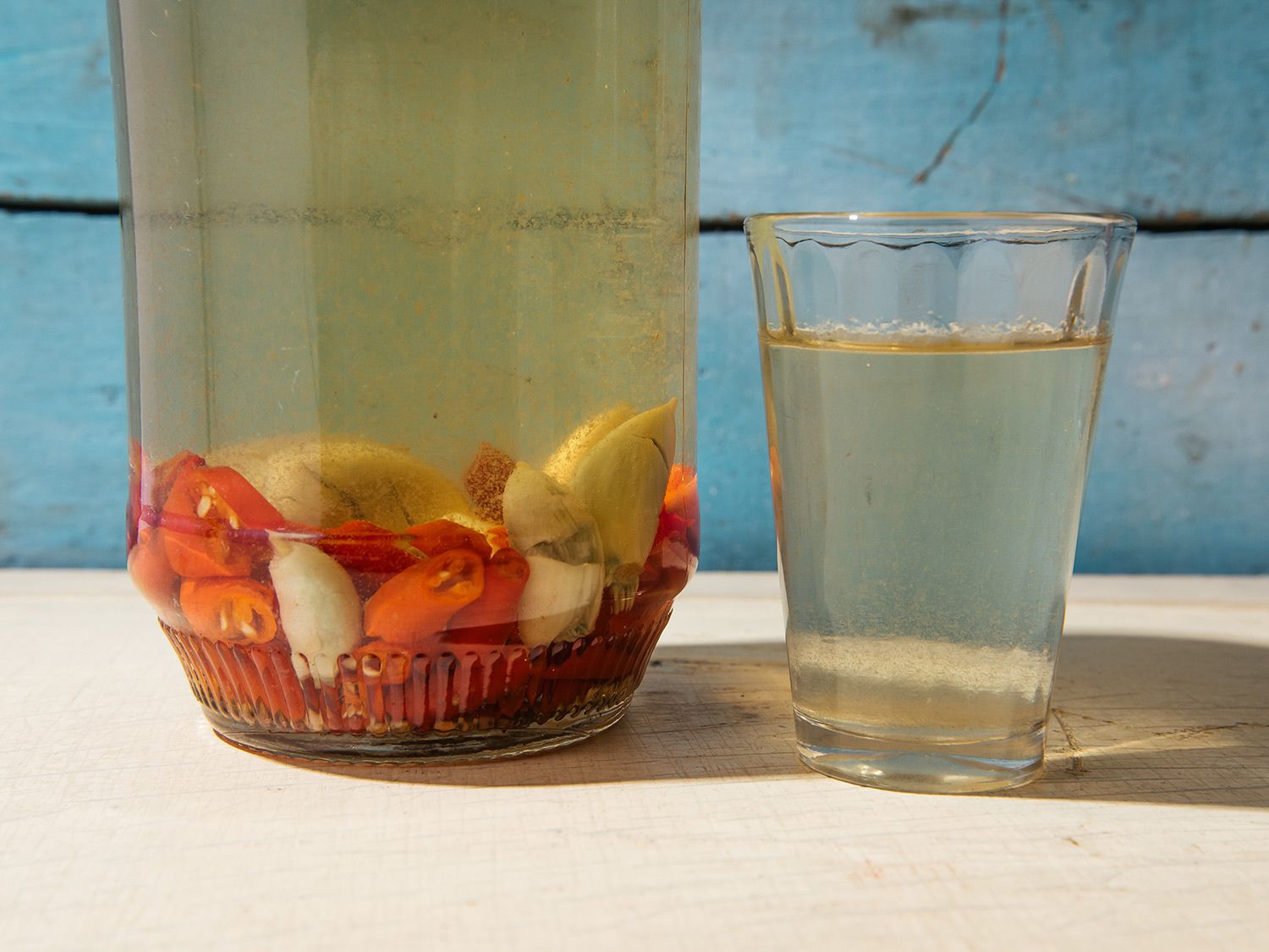 Portuguese and Filipino immigrants introduced vinegar and garlic to Hawaii, where the ingredients are often used in the condiment/chaser known as chile pepper water. Get the recipe for <a href="https://www.saveur.com/hawaiian-chile-pepper-water-with-garlic-and-vinegar-recipe/">Hawaiian Chile Pepper Water with Garlic and Vinegar</a>