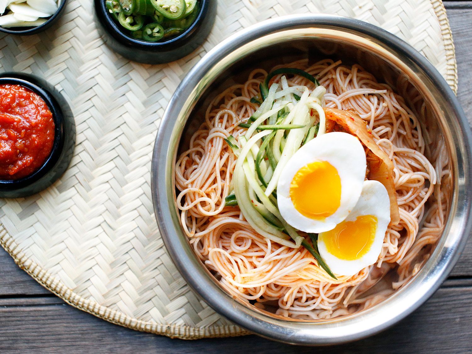 Asian pear and a touch of sugar tame the heat of gochujang in this Korean cold noodle dish, while rice vinegar adds a satisfying tang. Get the recipe for <a href="https://www.saveur.com/korean-spicy-cold-noodles-bibim-guksu-recipe/">Korean Spicy Cold Noodles (Bibim Guksu)</a>