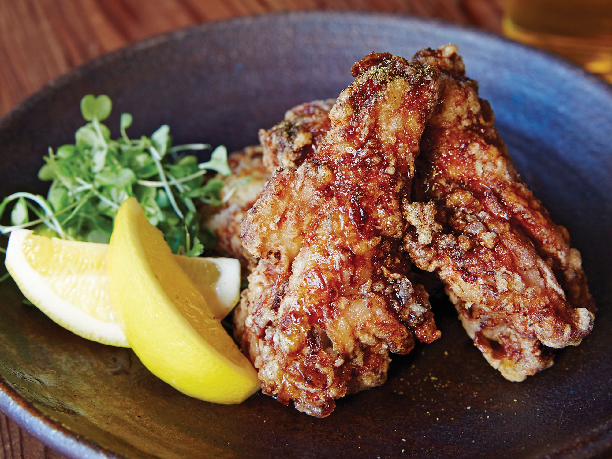 Sansho, the Japanese equivalent of Sichuan pepper, adds kick to these sake-and-mirin-marinated wings. A fresh squeeze of lemon brightens them up for serving. Get the recipe for <a href="https://www.saveur.com/article/recipes/japanese-fried-chicken-wings-teba-no-karaage-recipe/">Japanese-Style Chicken Wings</a>