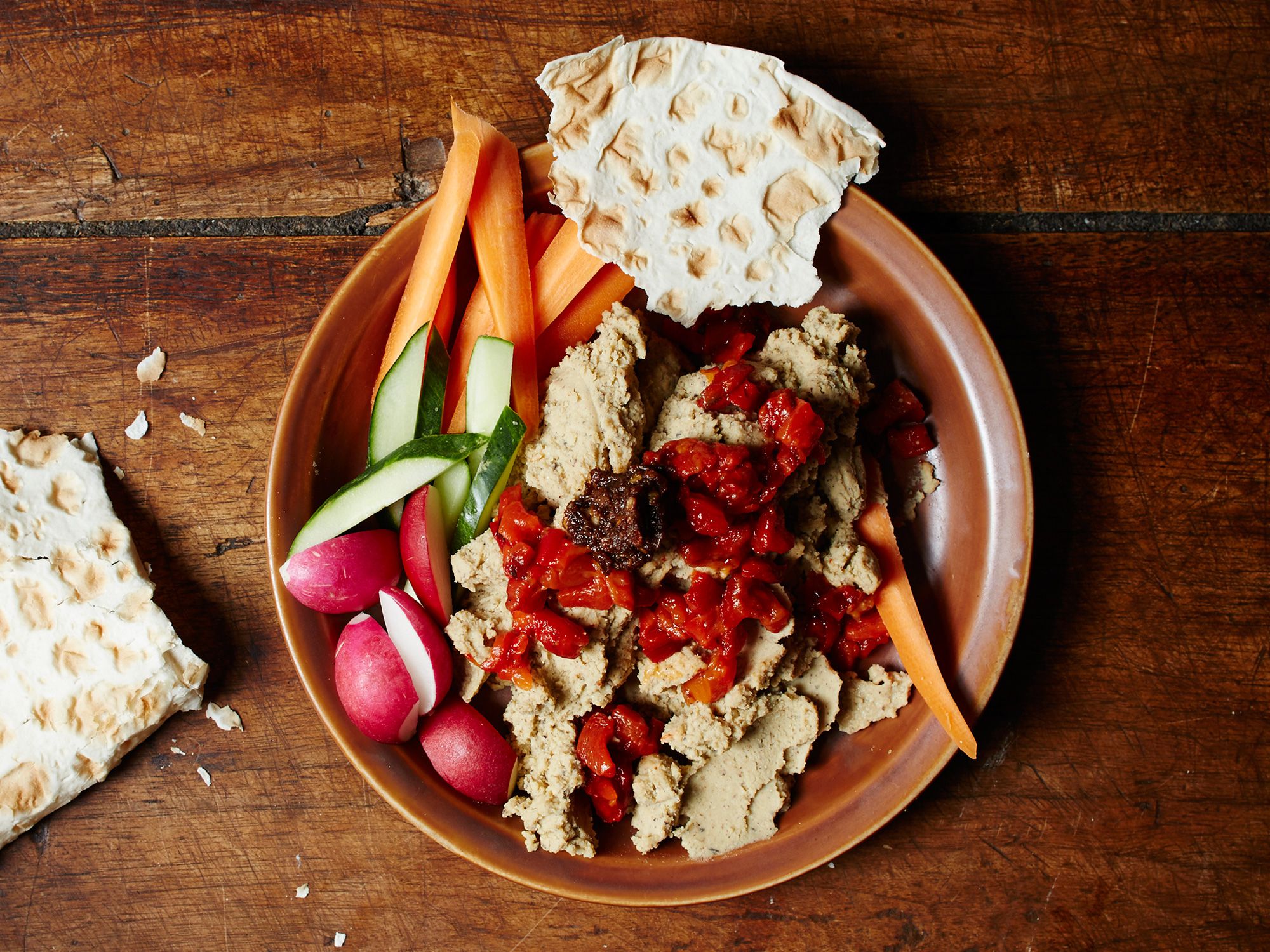 A sweet, hot, and aromatic chile paste is the garnish for this spread of black-eyed peas blended with palm oil and topped with roasted red peppers. Get the recipe for <a href="https://www.saveur.com/black-eyed-pea-hummus-west-african-chile-paste-recipe/">Black-Eyed Pea Hummus with West African Chile Paste</a>