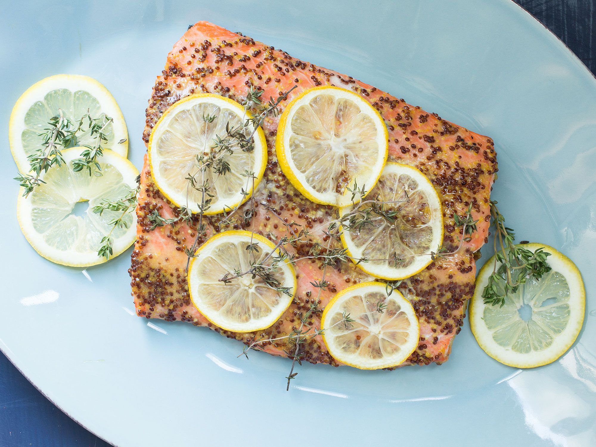 Whole grain Dijon mustard and lemon brighten up roasted salmon in this simple dinner main from The Yellow Table's Anna Watson Carl. She especially likes it for entertaining: It's simple, comes together quickly, and requires little hands-on time. Get the recipe for <a href="https://www.saveur.com/article/recipes/roasted-salmon-with-honey-dijon-glaze/">Roasted Salmon with Honey-Dijon Glaze</a>