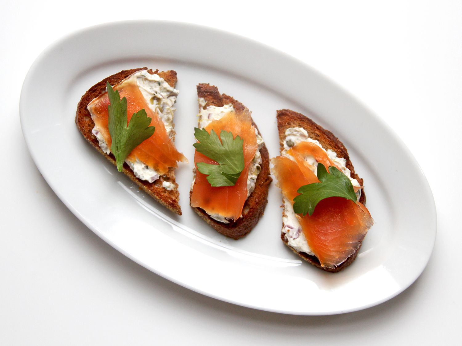 Cream cheese, capers, and red onions make for a lovely spread to pair with smoked salmon. Get the recipe for <a href="https://www.saveur.com/article/recipes/smoked-salmon-with-cream-cheese-capers-and-red-onion/">Smoked Salmon with Cream Cheese, Capers, and Red Onion</a>