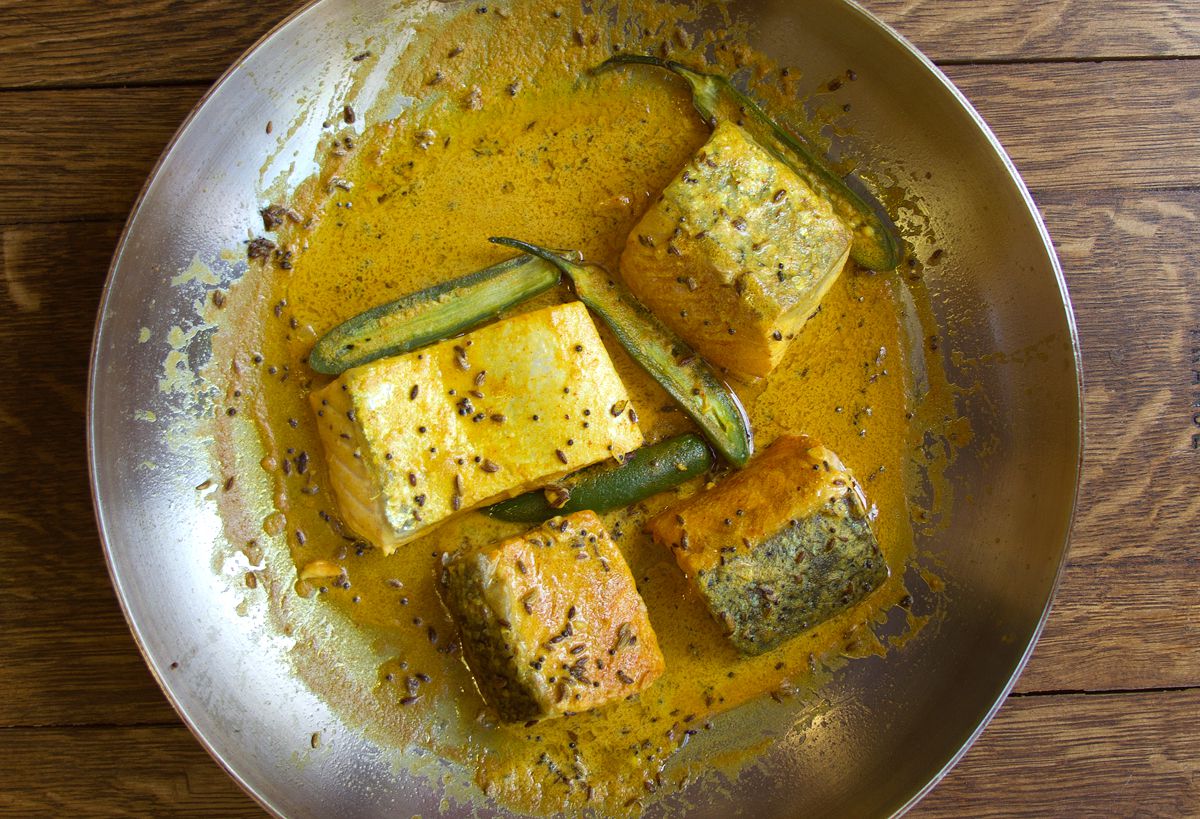 For this recipe, skinless salmon filets are cooked in a spice-filled mustard sauce. Get the recipe for <a href="https://www.saveur.com/article/Recipes/Salmon-in-Bengali-Mustard-Sauce/">Salmon in Bengali Mustard Sauce</a>