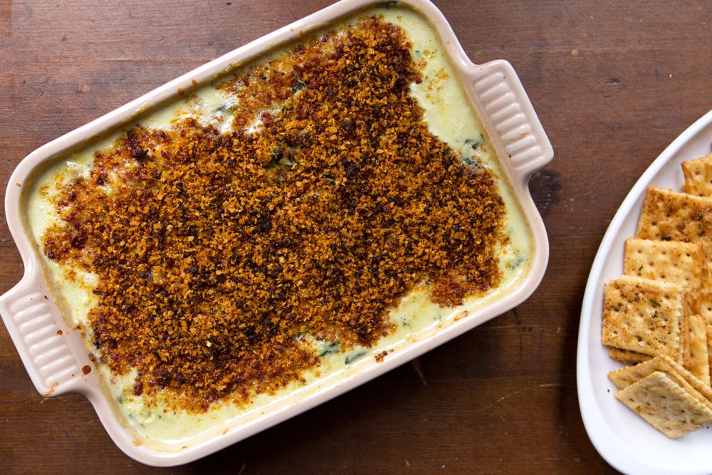 Crab dip is made even better when mixed with artichokes and spinach and topped with crispy pepperoni and cracker crumbs. Get the recipe for <a href="https://www.saveur.com/article/recipes/crab-spinach-and-artichoke-dip/">Crab, Spinach, and Artichoke Dip</a>