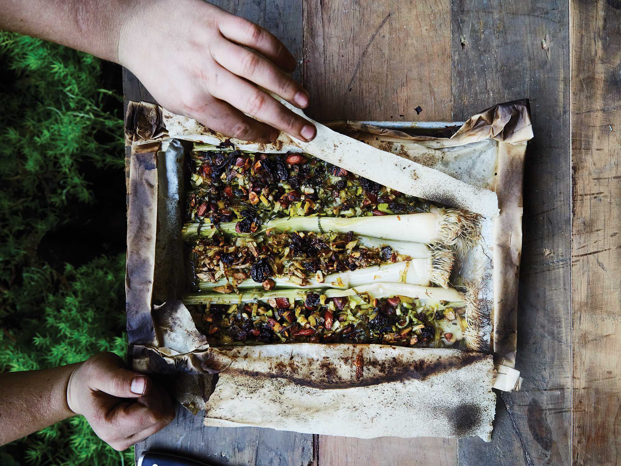 The bold flavors of blue cheese, anchovies, and Worcestershire sauce—plus a little kiss from the flame—make otherwise mild-flavored leeks just the thing for a cold night by the fire. Get the recipe for <a href="https://www.saveur.com/stuffed-leeks-with-blue-cheese-raisins-and-almonds-recipe/">Stuffed Leeks with Blue Cheese, Raisins, and Almonds</a>