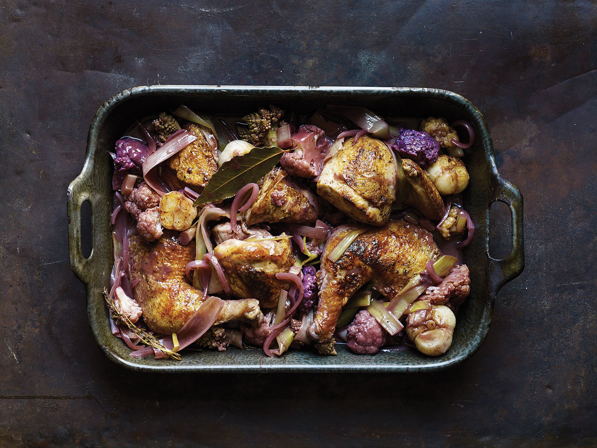 Cauliflower, leeks, and bay leaf infuse this chicken dish's luscious, reduced red wine sauce with flavor. Get the recipe for<a href="http://www.saveur.com/chicken-cauliflower-leeks-red-wine-sauce-recipe"> Chicken with Cauliflower and Leeks in Red Wine Sauce</a>