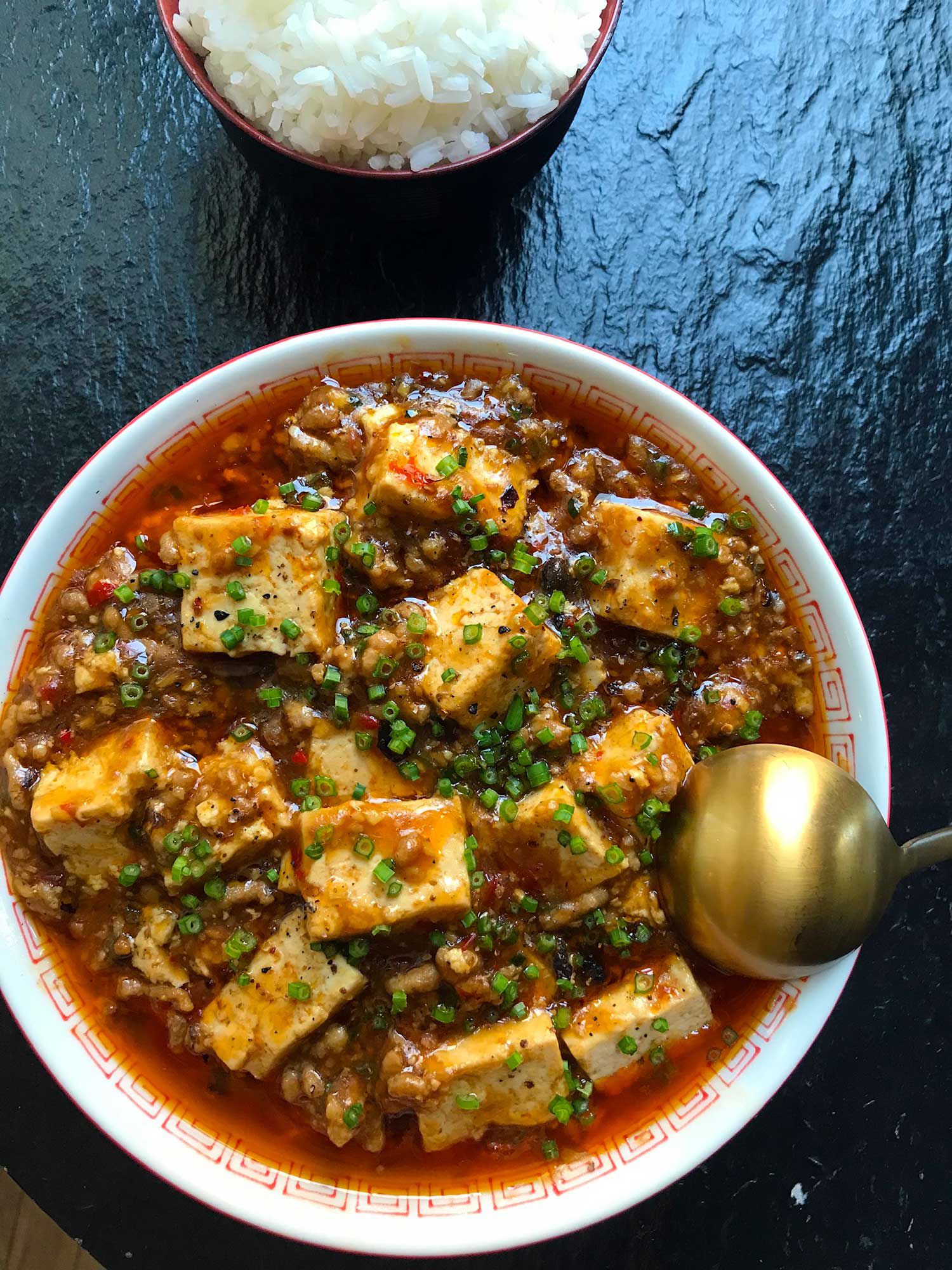 In this Sichuan classic, tofu and ground pork or beef are braised in a fiery red chile sauce. Get the recipe for <a href="https://www.saveur.com/article/Recipes/Mapo-Tofu/">Mapo Tofu</a>