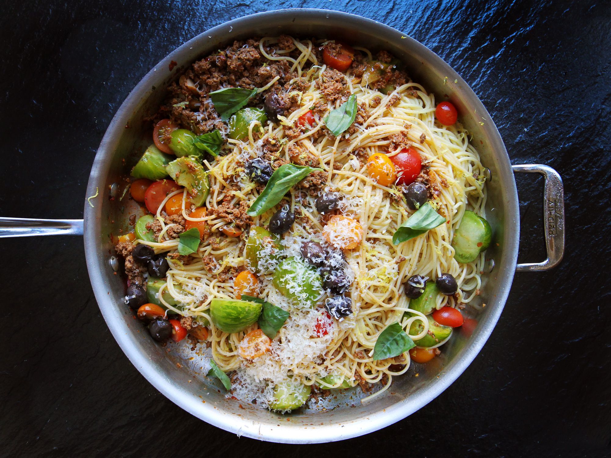This recipe for summer bolognese has the classic comfort of bolognese, but without the heaviness of a red sauce, instead embracing the summer's bounty of gorgeous tomatoes and fresh basil. Get the recipe for <a href="http://www.saveur.com/summer-bolognese-recipe">Summer Bolognese</a>