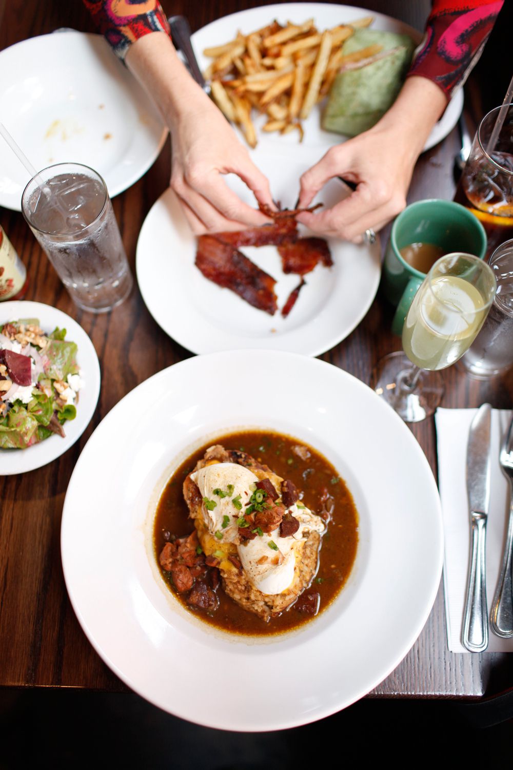 Chef Justin Girouard of the French Press restaurant in Lafayette, Louisiana, replaces the Canadian bacon and hollandaise with boudin and gumbo in this bayou-based twist on the classic breakfast dish. Get the recipe for <a href="https://www.saveur.com/article/Recipes/Cajun-Benedict/">Cajun Benedict</a>