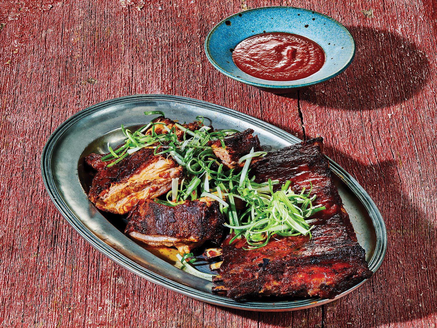 Perfect for parties, these ribs pre-roast in the oven, then crisp up under the broiler. Ask your butcher for a Denver cut: the lamb rib equivalent of St. Louis–style pork spare ribs, which is a fatty portion from the belly side. Get the recipe for <a href="https://www.saveur.com/lamb-ribs-with-spicy-harissa-barbecue-sauce-recipe/">Lamb Ribs with Spicy Harissa Barbecue Sauce</a>