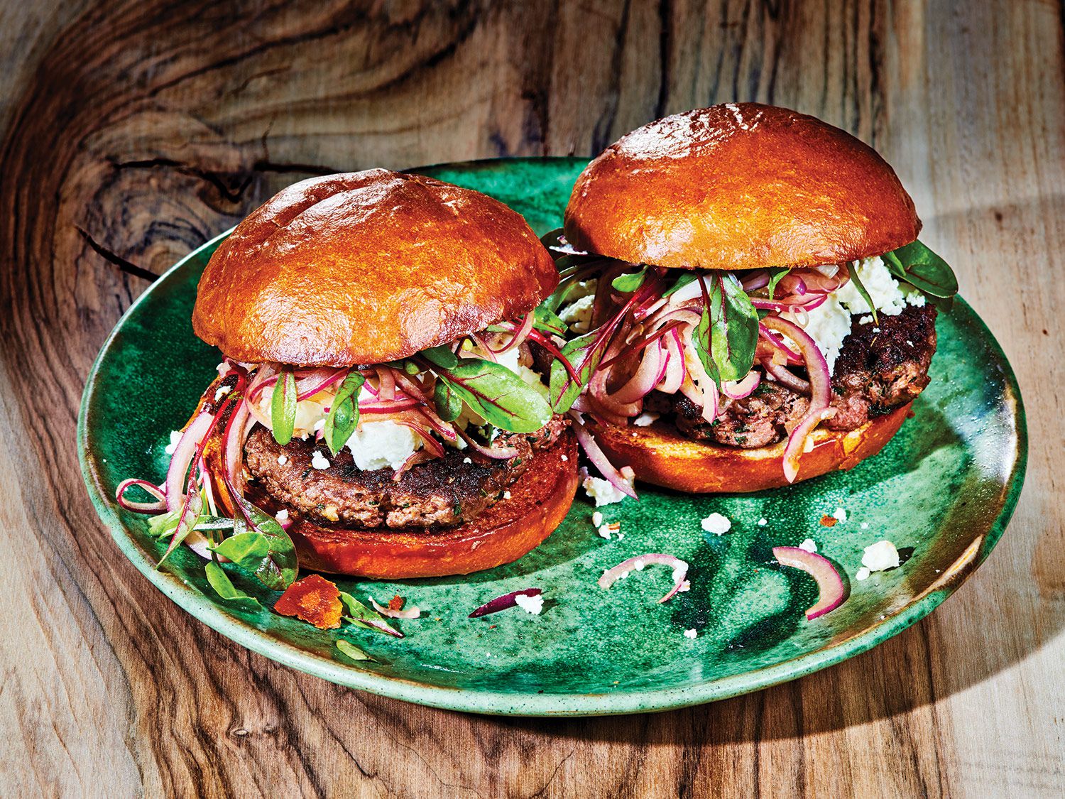 At the Marketplace at Emerald Valley in Washington, Pennsylvania, lemon zest and fresh mint go into every lamb burger patty. A tangle of sweet balsamic onions, a hint of chile, and briny feta balance the charred meat and brioche bun. Ground lamb falls on the fattier side; if using a grill, watch out for flare-ups. <a href="https://www.saveur.com/lamb-burger-with-mint-feta-and-balsamic-onions-recipe/">Lamb Burger with Mint, Feta, and Balsamic Onions</a>
