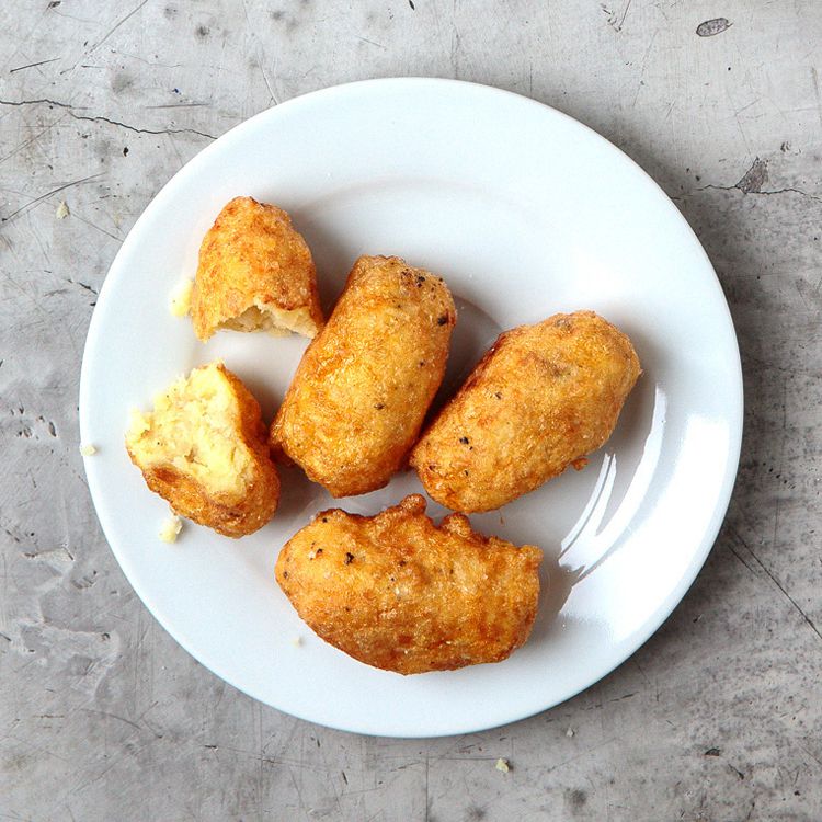 To make these crisp-crusted fritters, mashed potatoes blended with pan-fried shallots and freshly grated nutmeg are dipped in beaten egg and fried. Get the recipe for <a href="https://www.saveur.com/article/recipes/perkedel-kenteng-padang-style-mashed-potato-fritters/">Padang-Style Mashed Potato Fritters (Perkedel Kenteng)</a>