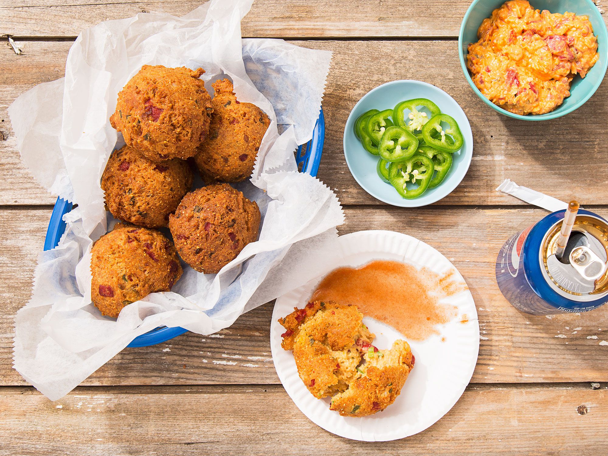 The typical cornbread fritter done better: now full of zesty pimento cheese. Get the recipe for <a href="https://www.saveur.com/pimento-cheese-hushpuppies-recipe/">Pimento Cheese Hushpuppies</a>