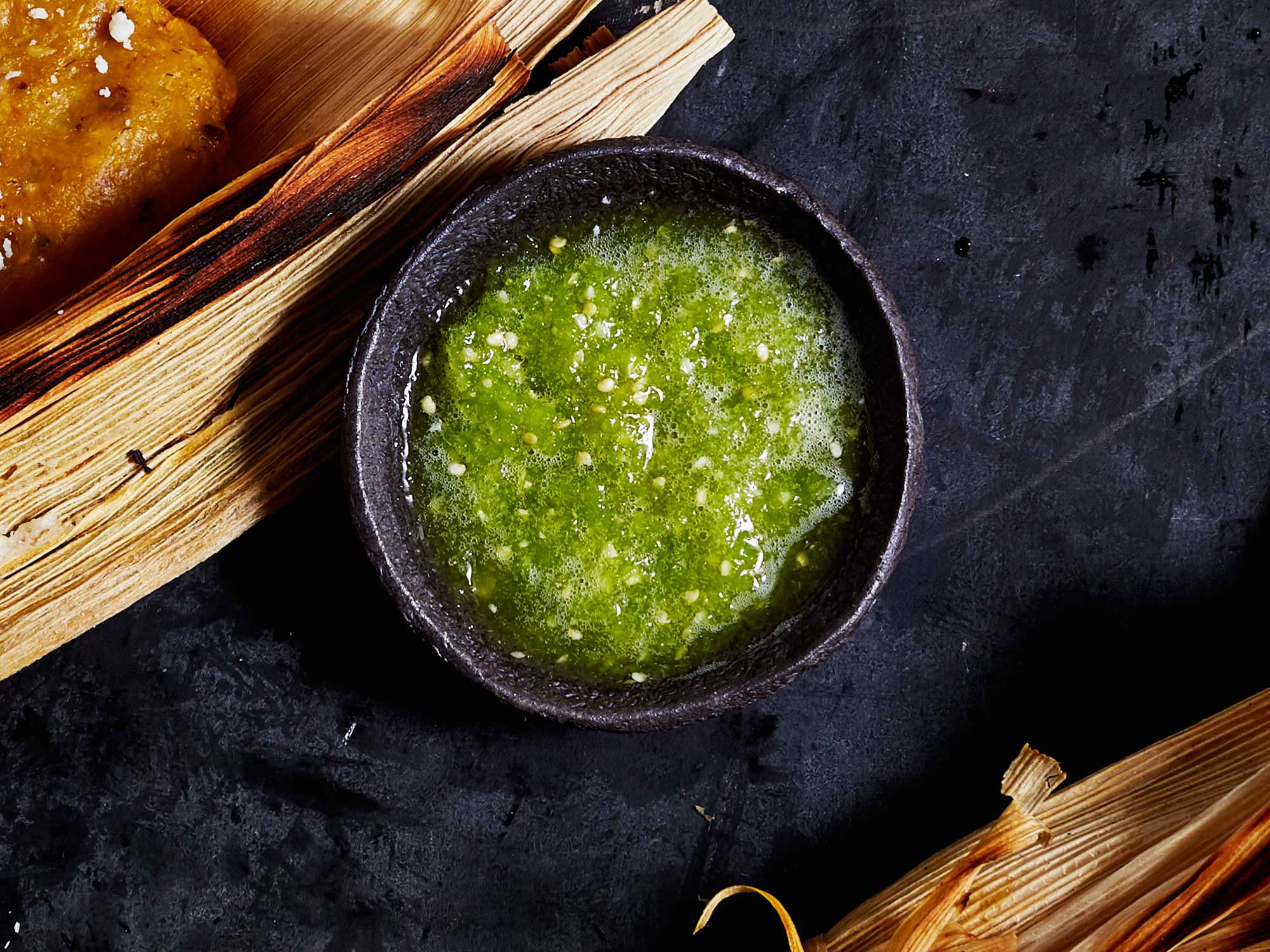 This salsa verde has a fresh, tangy sourness (and kick of heat if you like) that helps cut through richness. Get the recipe for <a href="http://www.saveur.com/tomatillo-salsa-verde-recipe">Tomatillo Salsa</a>
