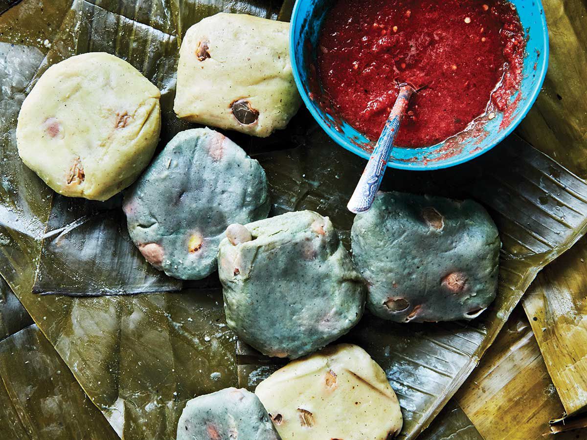 Meat and fat are scarce in Chiapas, so the local tamale dough is much leaner than it is in other regions. The most common meatless versions at the markets in southern Chiapas are wrapped in banana leaves and can include greens like hoja santa or chilipin, as well as black beans. At Yo'on Ixim in Puebla, the women make both blue corn and white corn versions, sometimes adding fresh shelling beans. Frozen banana leaves are easy to come by in Asian supermarkets—moisten them with water to keep them pliable while filling. Get the recipe for <a href="https://www.saveur.com/charred-tomato-and-chile-salsa-recipe/">Charred Tomato and Chile Salsa</a>