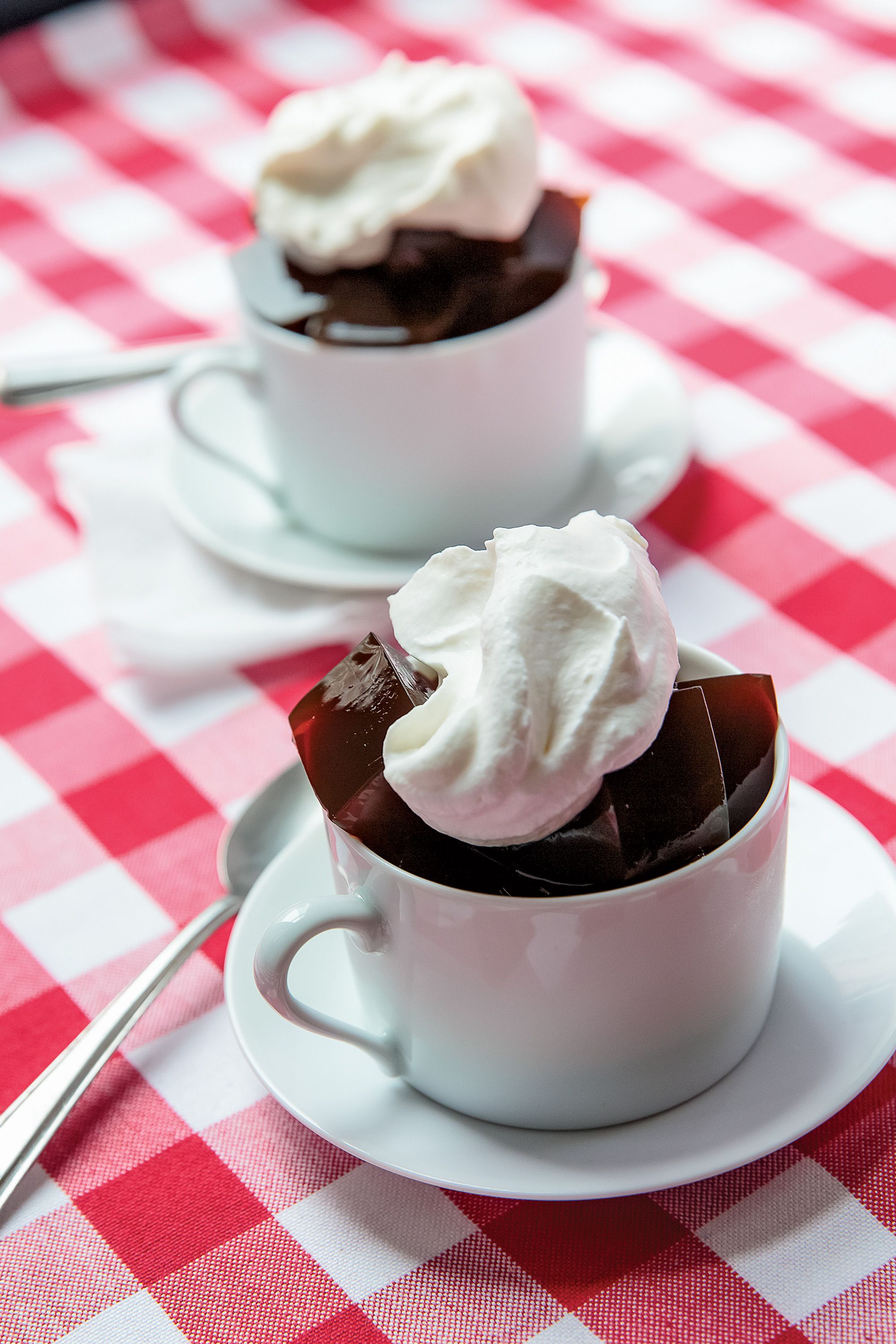 Served in glistening mahogany cubes, this caffeinated dessert caps off the meal at Boston's Durgin-Park. Get the recipe for <a href="https://www.saveur.com/article/recipes/coffee-gelatin-with-whipped-cream/">Coffee Gelatin with Whipped Cream</a>