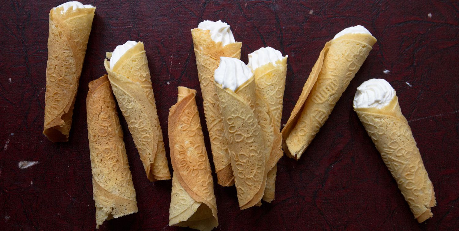 These Norwegian wafer cookies, eaten across Scandinavia during the Christmas season, are light and crisp and perfumed with cardamom. They're made like waffles on a special griddle that imprints an intricate design, and then they're rolled and filled with whipped cream. Get the recipe for <a href="https://www.saveur.com/article/Recipes/Krumkakes-Norwegian-Wafer-Cookies/">Norwegian Wafer Cookies (Krumkakes)</a>