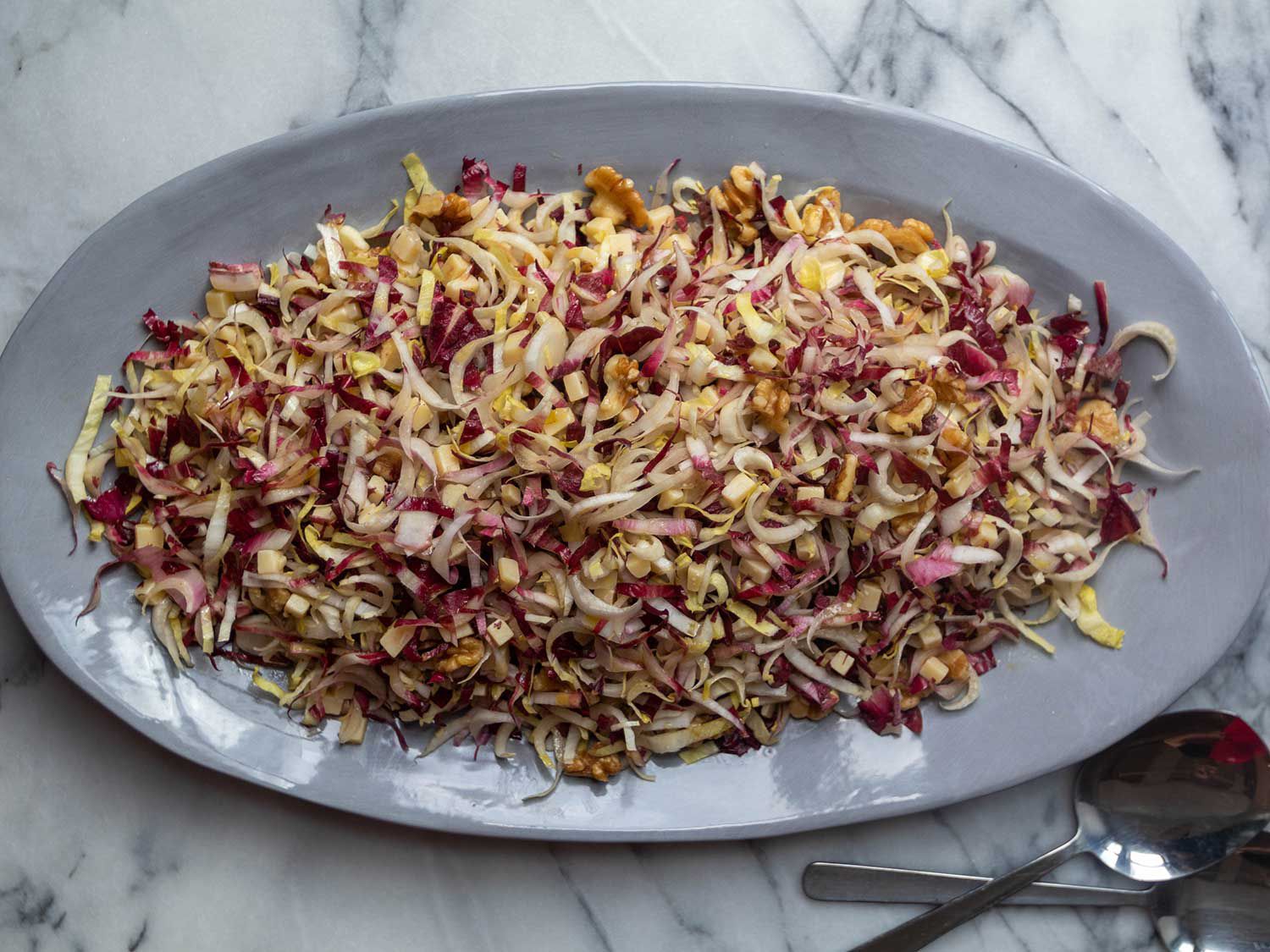 A zingy sherry-Dijon vinaigrette offsets the bitterness of the endives and cuts through the richness of the nuts and cheese in this rustic French salad. Get the recipe for <a href="https://www.saveur.com/article/Recipes/Endive-and-Walnut-Salad/">Endive and Walnut Salad</a>