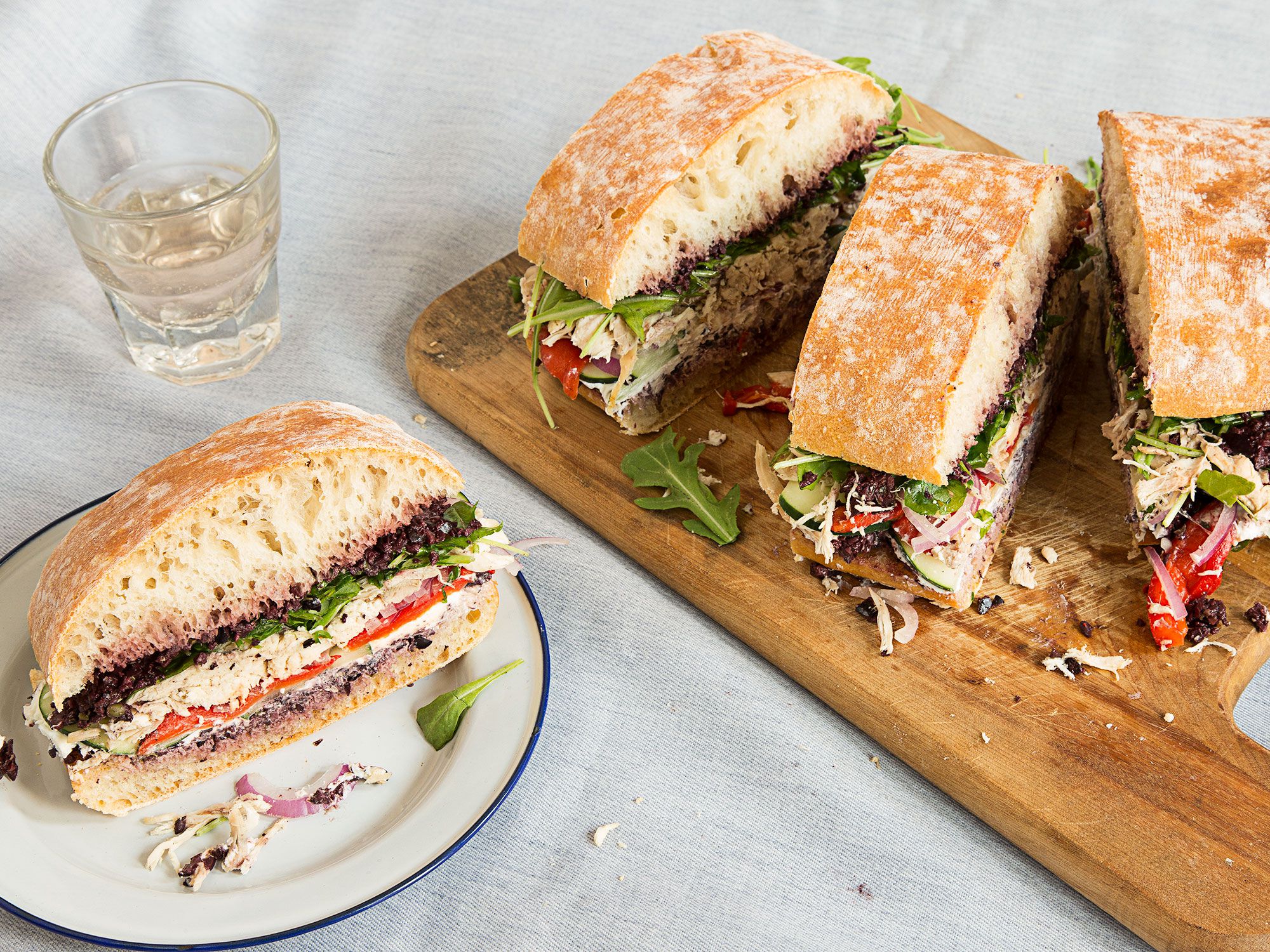 This hearty twist on the classic Provençal pressed sandwich pan bagnat combines black olive tapenade, goat cheese, roasted chicken, and thinly sliced vegetables. Make it at least two to three hours before you plan to serve it to really let the flavors marry. Get the recipe for <a href="http://www.saveur.com/roast-chicken-pan-bagnat-provencal-chicken-sandwich-recipe">Roast Chicken Pan Bagnat with Olive Tapenade and Goat Cheese</a>
