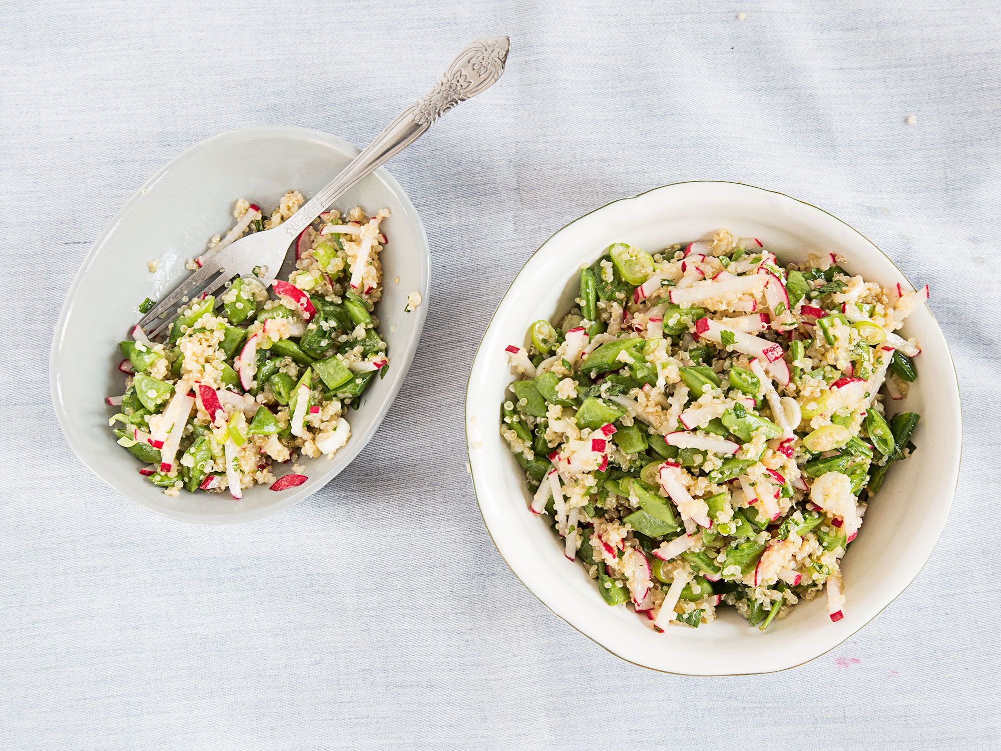This light quinoa salad, filled with scallions, mint, snap peas, and crisp haricots verts tossed in a Dijon vinaigrette, makes a perfect summer side dish for picnics and barbecues. Get the recipe for <a href="https://www.saveur.com/quinoa-salad-sugar-snap-peas-scallions-and-mint-recipe/">Quinoa Salad with Snap Peas, Scallions, and Mint</a>