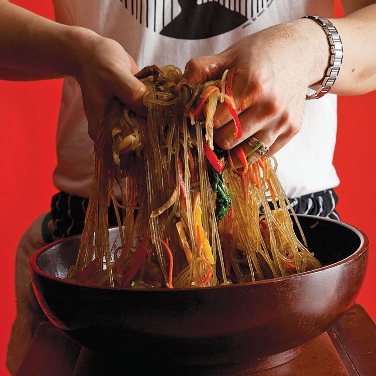 Slippery sweet potato noodles turned golden from the cooking juices and soy sauce, crunchy vegetables, and tender beef make for a satisfying dish. Get the recipe for <a href="https://www.saveur.com/article/Recipes/Chap-Chae/">Korean Noodles with Beef and Vegetables (Chap Chae)</a>