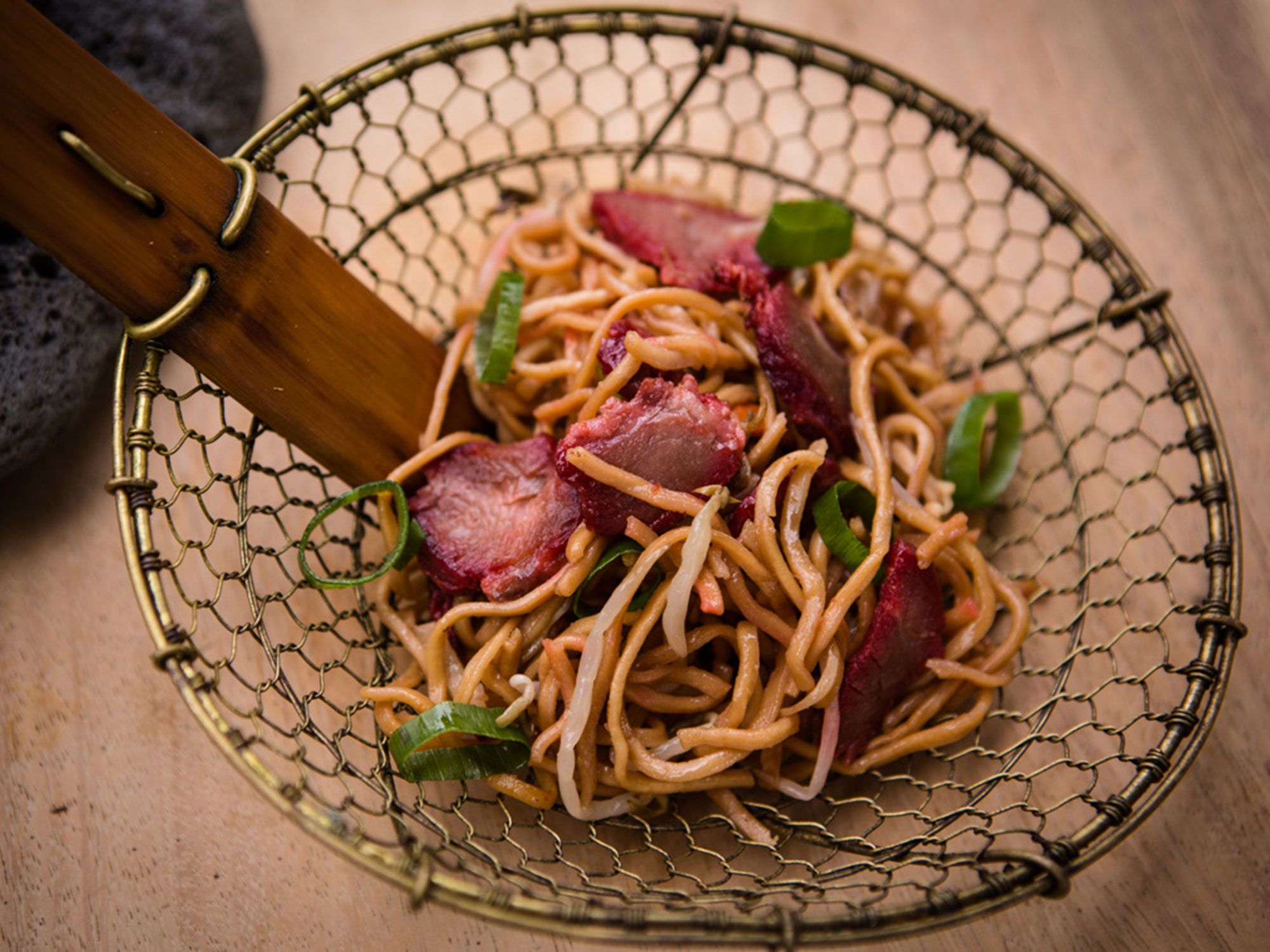 For a twist on classic char siu, Hawaiian islanders typically marinate wild boar—pork shoulder makes a fine substitute—in Chinese-style barbecue sauce. Get the recipe for <a href="https://www.saveur.com/hawaiian-barbecue-roast-pork-sesame-noodles-recipe/">Sweet and Sticky Roast Pork with Sesame Noodles</a>