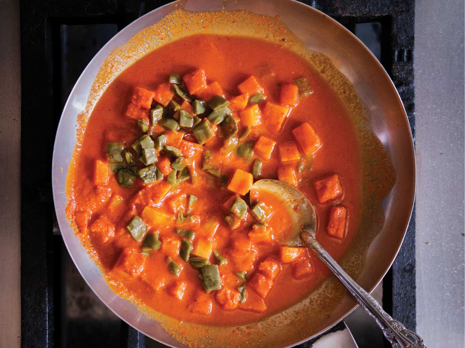 Potatoes and cactus paddles in a richly spiced sauce of tomatoes and chiles. Get the recipe for <a href="https://www.saveur.com/story/recipes/red-mole-with-potatoes-and-nopales/">Red Mole with Potatoes and Nopales (Papasmole)</a>