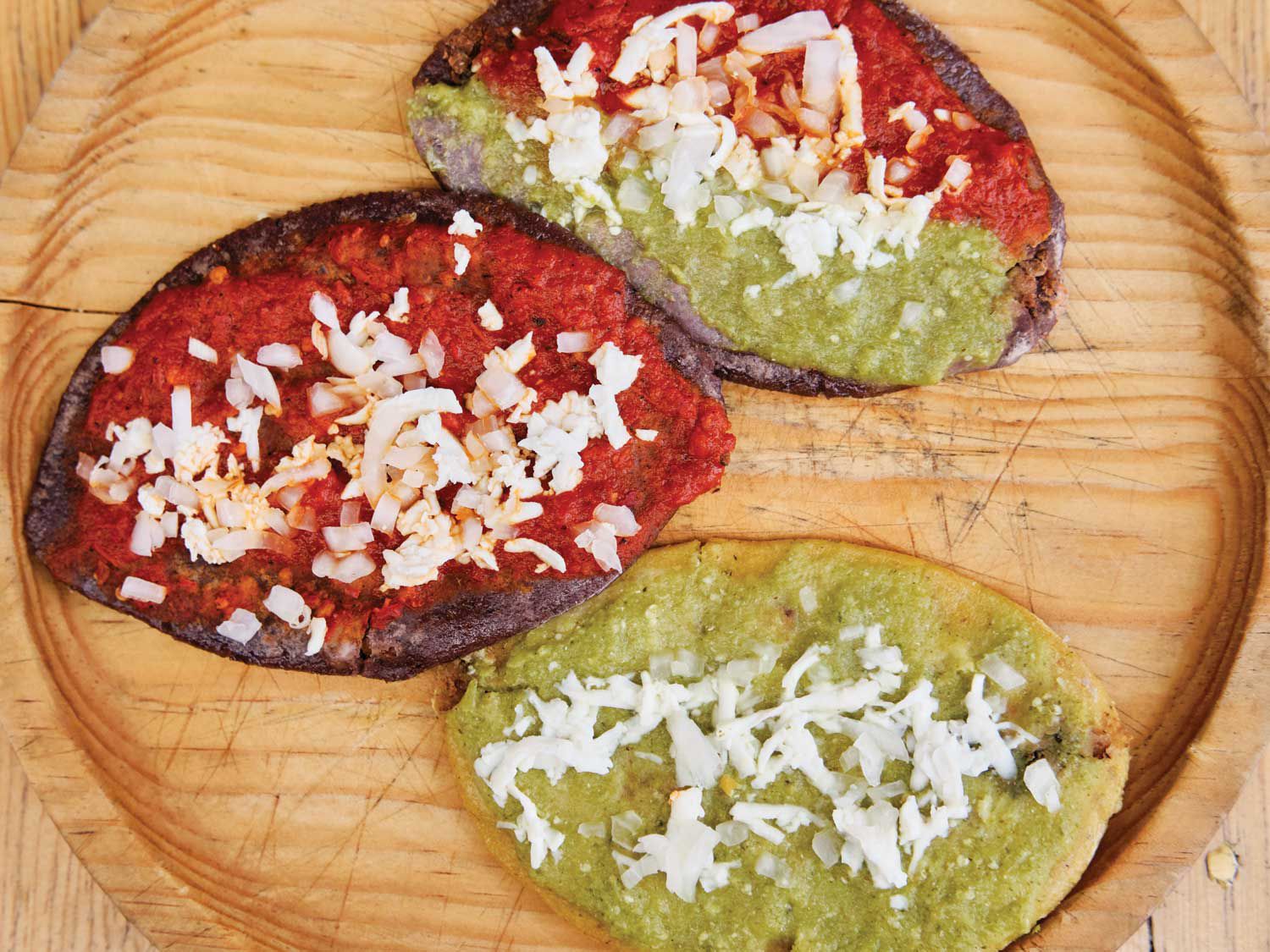 <em>Tlacoyos</em> stuffed with refried ayocote beans. Get the recipe for <a href="https://www.saveur.com/story/recipes/ayocote-bean-tlacoyos/">Ayocote Bean Tlacoyos</a>