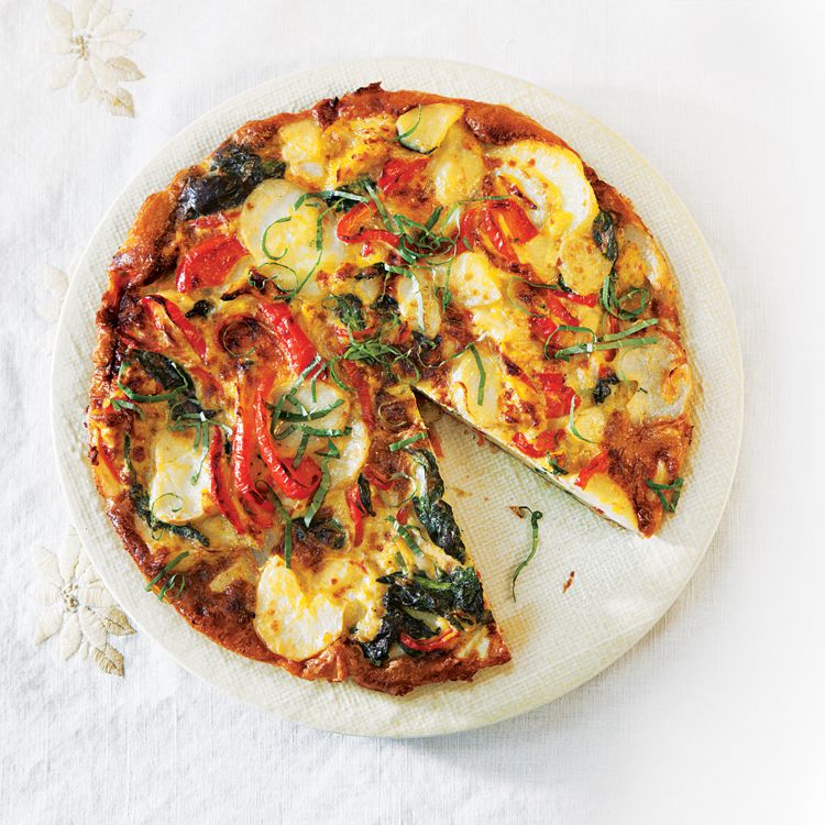 This basil-laced potato and vegetable frittata makes a satisfying lunch. Get the recipe for <a href="https://www.saveur.com/article/recipes/potato-spinach-and-red-pepper-frittata/">Potato, Spinach, and Red Pepper Frittata</a>