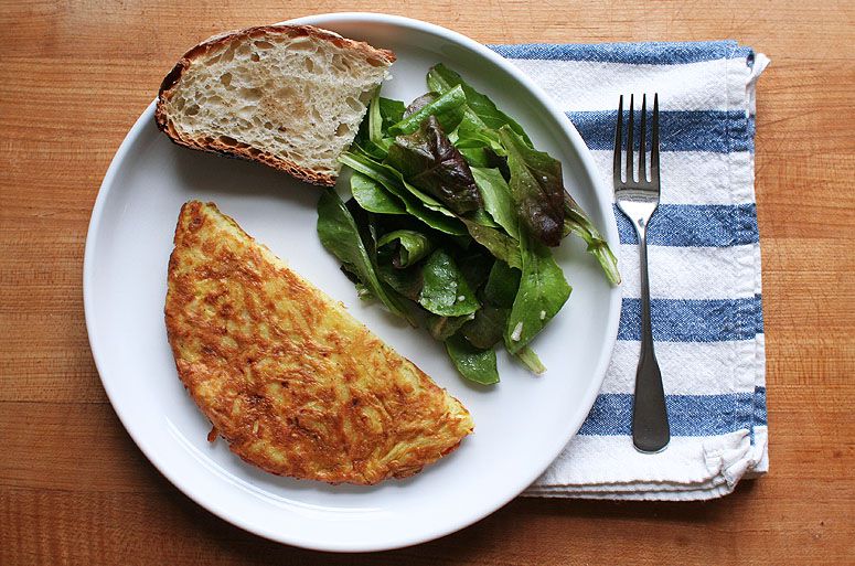 This simple potato and cheese omelette, from <em>The Good Cook: Eggs &amp; Cheese</em>, was shared with us by Tim Mazurek to accompany his Back of the Bookshelf column. It's perfect for brunch, and also—accompanied with a glass of wine and a green salad—makes a satisfying, affordable dinner. Get the recipe for <a href="https://www.saveur.com/article/Recipes/Grated-Potato-and-Cheese-Omelet/">Grated Potato and Cheese Omelette</a>