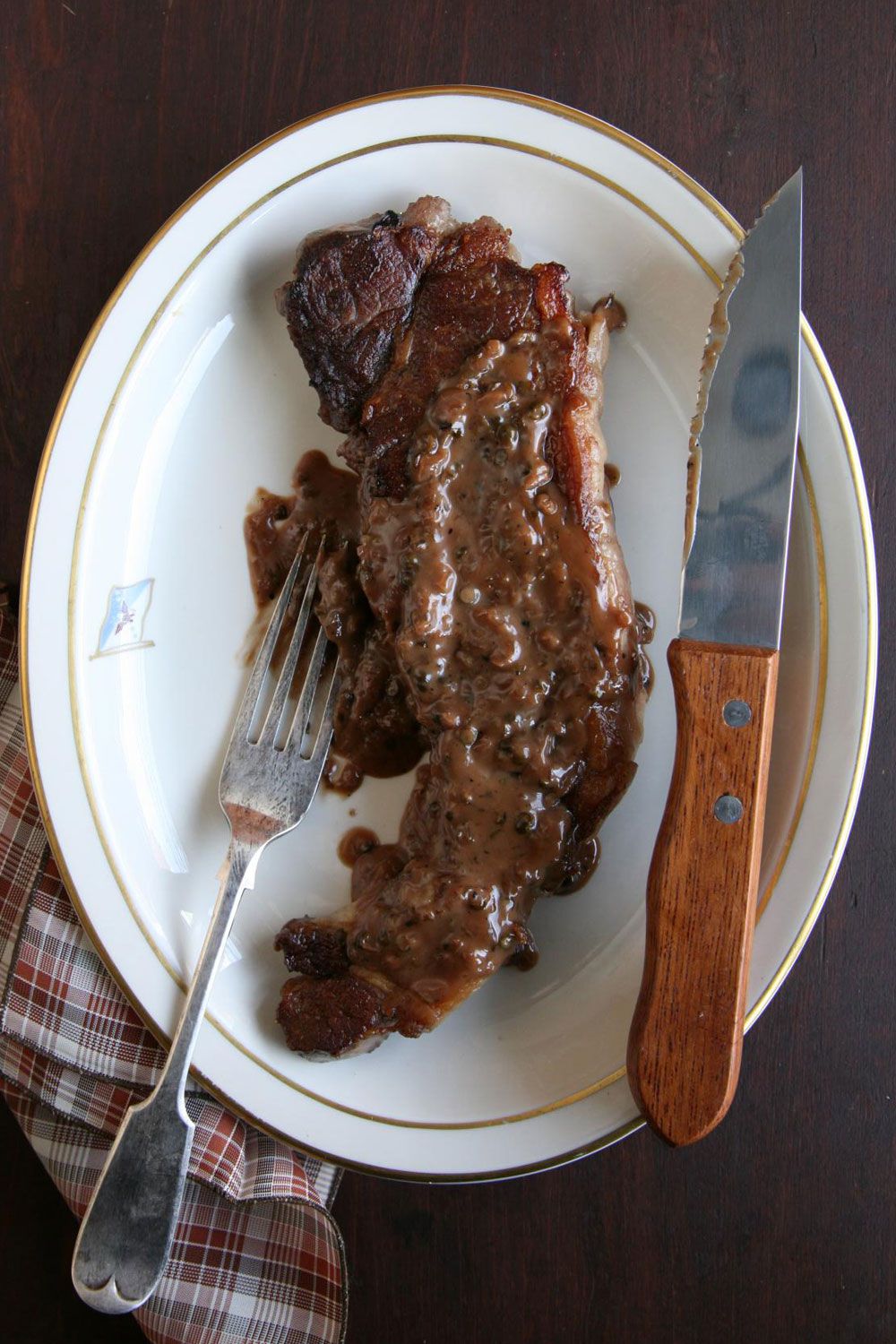 The recipe for this dish is based on one in Glorious French Food by our friend James Peterson. "Strictly speaking," writes Peterson, "an entrecote is a boneless rib steak ... but nowadays, in good places at least, [it's] a contre-filet (what in New York is called a strip steak)." Get the recipe for <a href="https://www.saveur.com/article/Recipes/Strip-Steaks-with-Green-Peppercorn-Sauce/">Strip Steaks with Green Peppercorn Sauce</a>