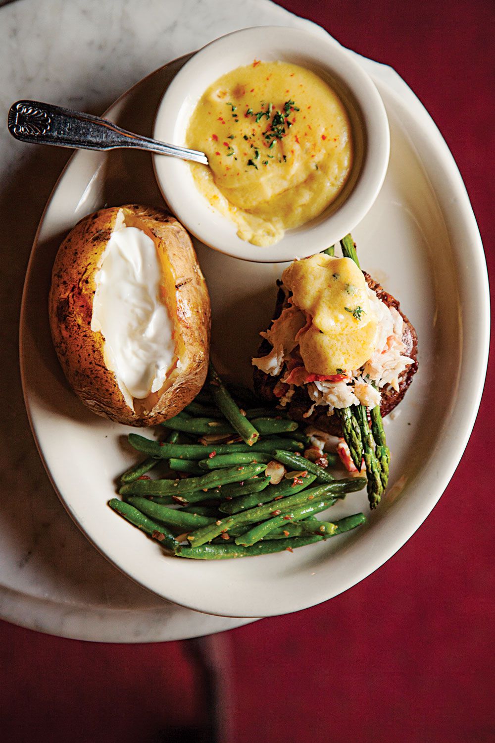 Brother Sebastian's in Omaha serves up a decadent crab-and-hollandaise-draped riff on surf and turf. Get the recipe for <a href="http://www.saveur.com/article/recipes/Filet-Oskar-Steak-with-Crab-and-Hollandaise">Filet Oskar (Steak with Crab and Hollandaise)</a>