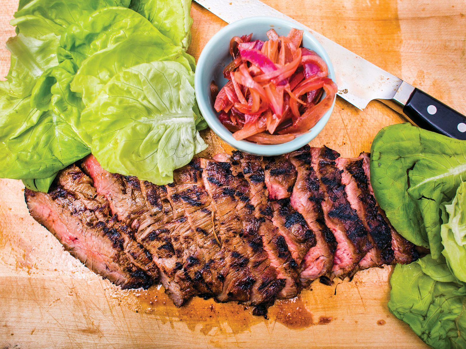 In Korea, lettuce is often used as a crisp wrapper for bulgogi (marinated beef). In this recipe, sweeter pickled onions take the place of spicy kimchi. Get the recipe for <a href="https://www.saveur.com/grilled-flank-steak-coca-cola-pickled-onions-recipe/">Grilled Flank Steak with Coca-Cola-Pickled Onions</a>