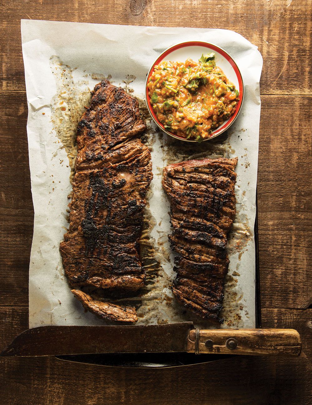 Sweet papaya and tart ruby red grapefruit juice tame the heat of the Scotch bonnet pepper in the marinade for the steak, while the vegetables for the accompanying jalapeño-laced salsa get charred on the fire along with the meat. Get the recipe for <a href="https://www.saveur.com/article/Recipes/Grapefruit-and-Habanero-Skirt-Steak-with-Grilled-Tomato-Salsa/">Grapefruit & Habanero Skirt Steak with Grilled Tomato Salsa</a>