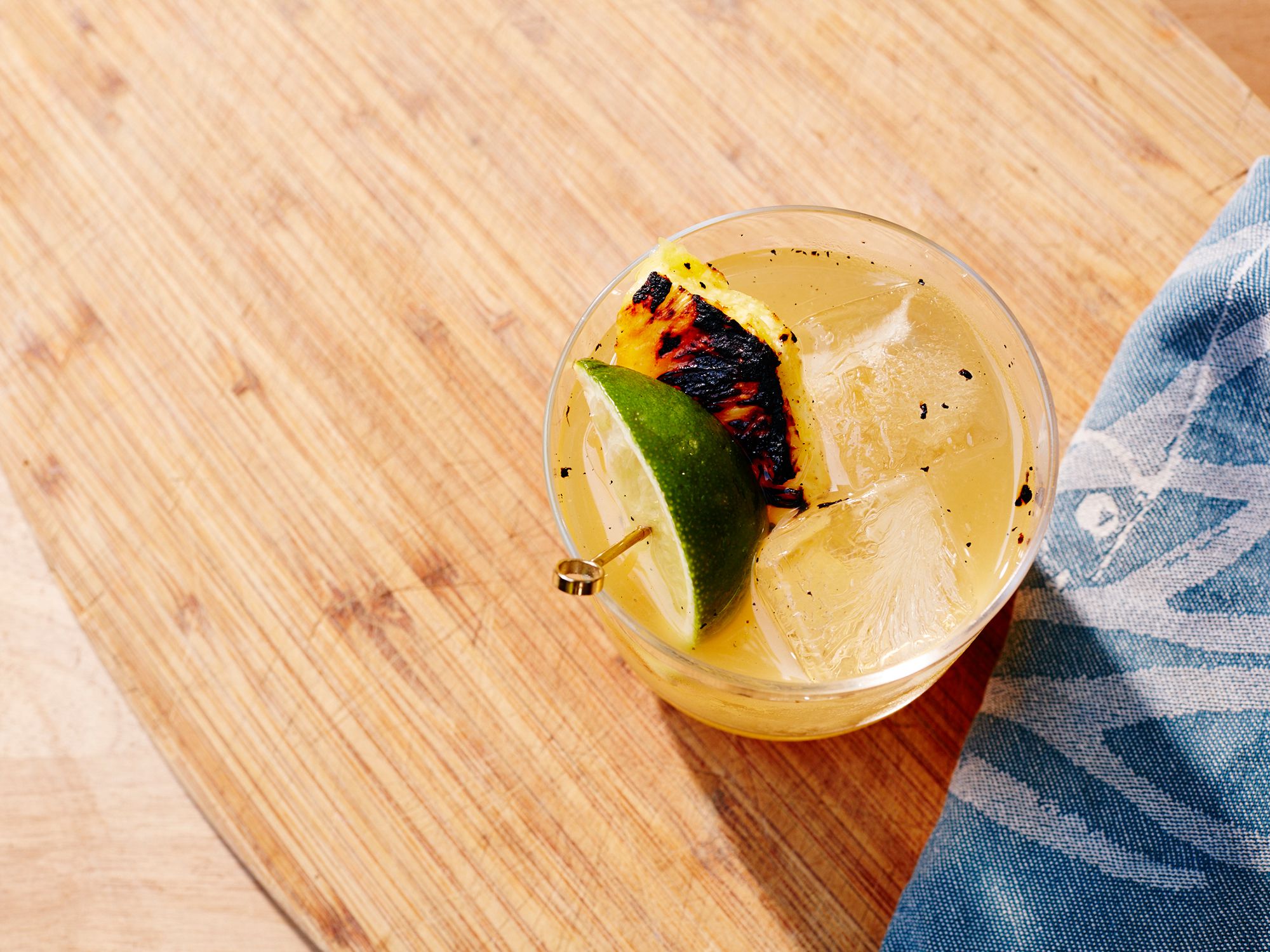 The Margarita is essential to America's canon of summertime drinks, and adding a grilled element makes it that much more American. Burnished pineapple adds a rich layer of fruitiness while mezcal lends a veil of smoke and spice. For even more smoke and spice, add a salt rim laced with chile powder and coriander. Get the recipe for <a href="http://www.saveur.com/grilled-pineapple-margarita-recipe">Grilled Pineapple Margarita</a>