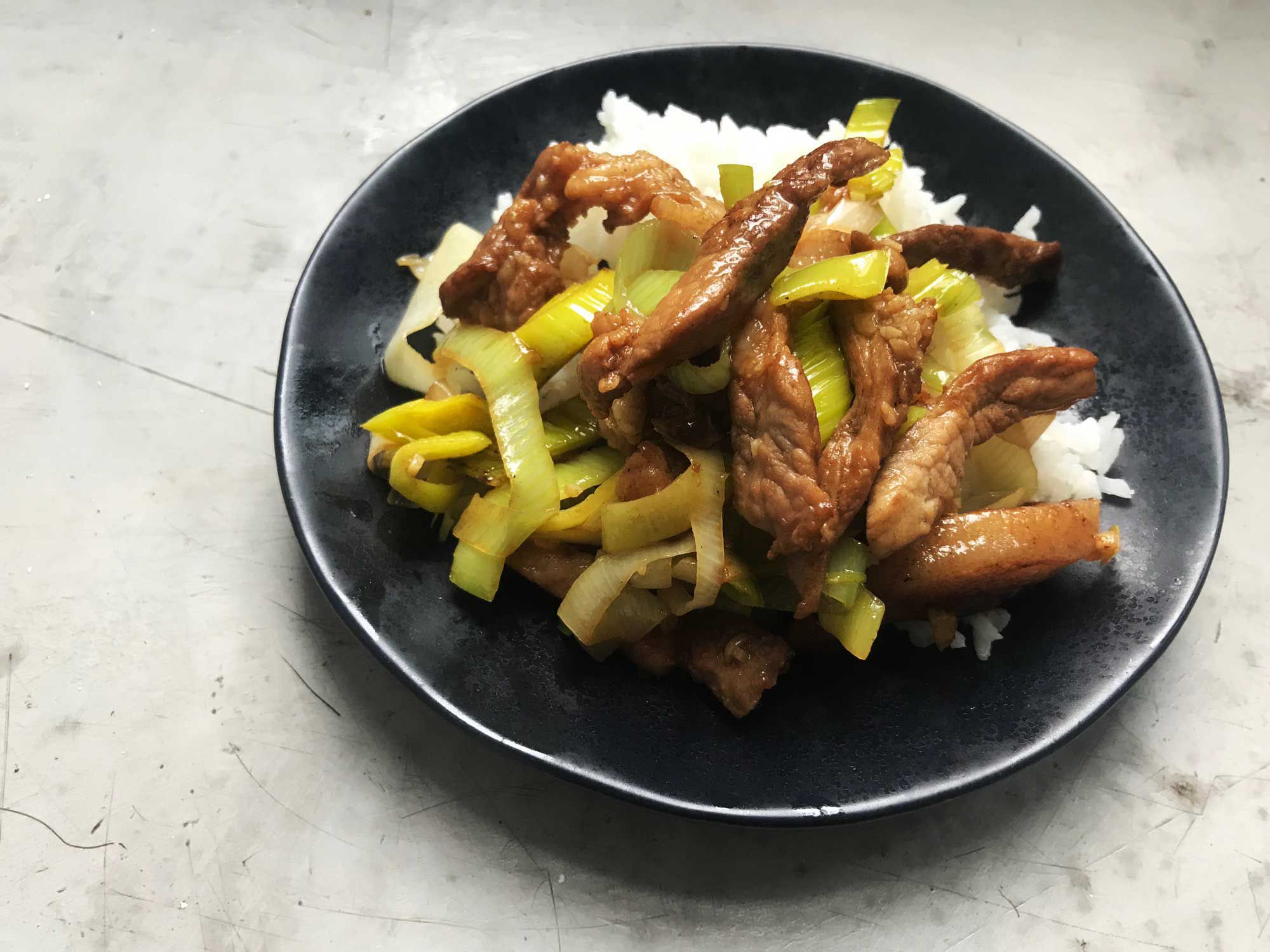 This recipe employs a "reverse" stir-fry technique, in which the vegetables are cooked before the meat. It tends to be forgiving for a novice stir-fryer, since vegetables release water as they cook and won't stick the way that meat will if the wok isn't quite hot enough. <a href="https://www.saveur.com/article/Recipes/Stir-Fried-Pork-with-Leeks-Cong-Bao-Rou-Si/">Get the recipe for Cong Bao Rou Si (Stir-Fried Pork with Leeks) »</a>