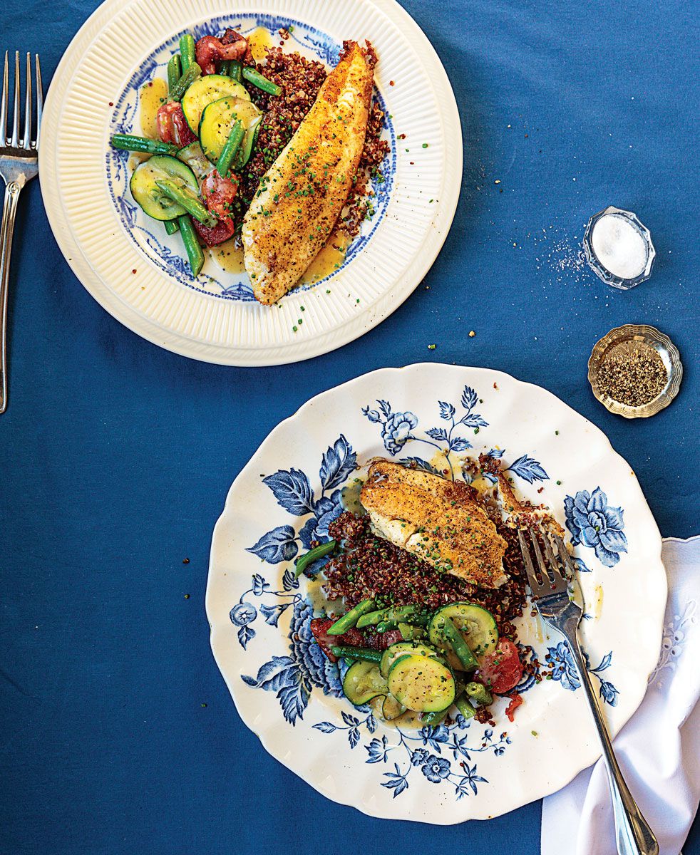 Filets of sole are set atop red quinoa, roasted tomatoes, and tender-crisp vegetables in this dish from a Marseille bistrot. <a href="https://www.saveur.com/article/recipes/pan-fried-sole-with-red-quinoa-and-vegetables/">Get the recipe for Pan-Fried Sole with Red Quinoa and Vegetables »</a>
